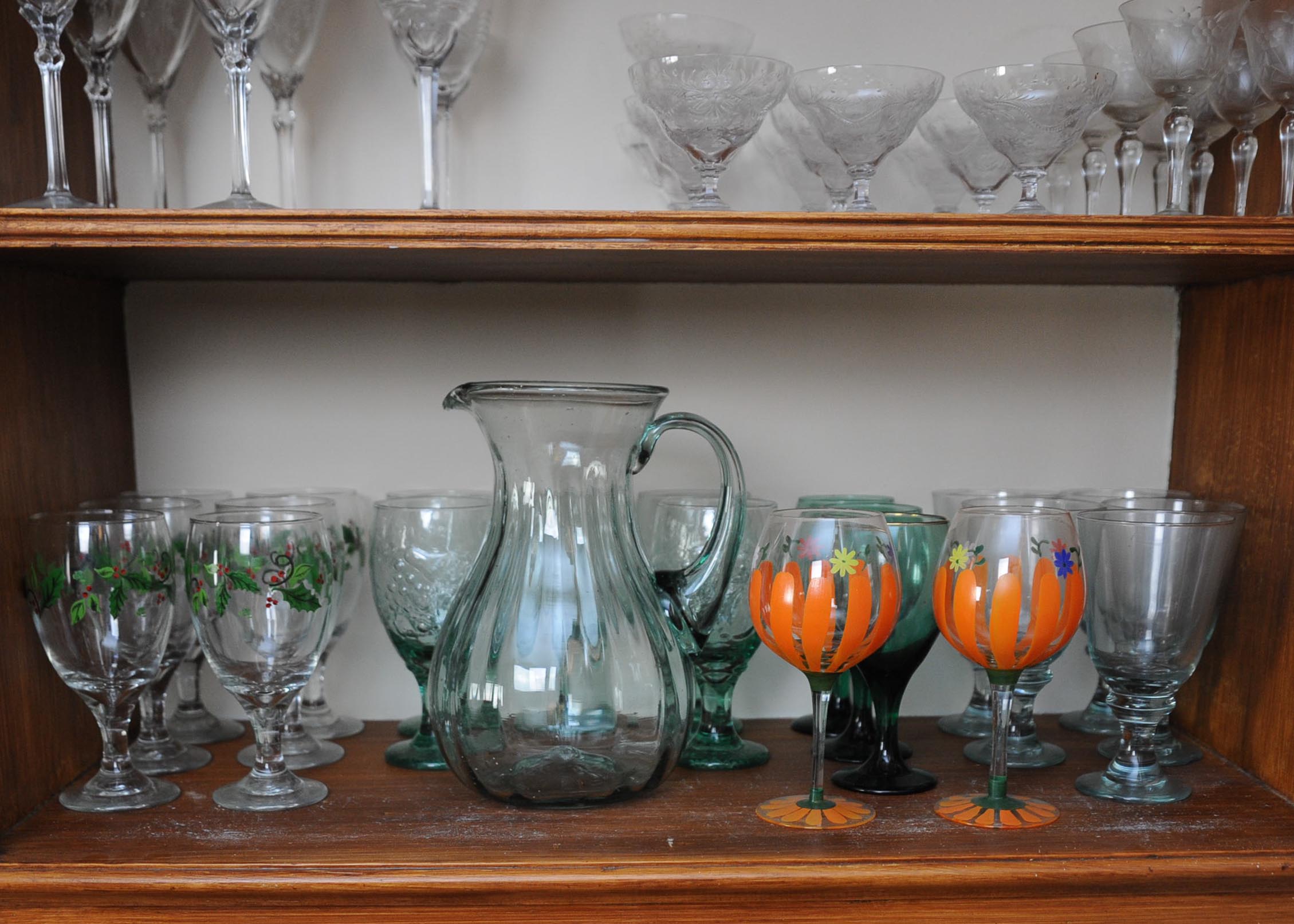 Two Shelves of Assorted Semi-Antique and Modern Glasses