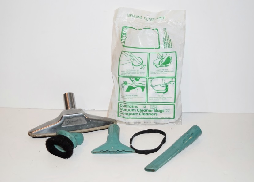 A Vintage 1940's Compact Electra Vacuum with Bags and Attachments