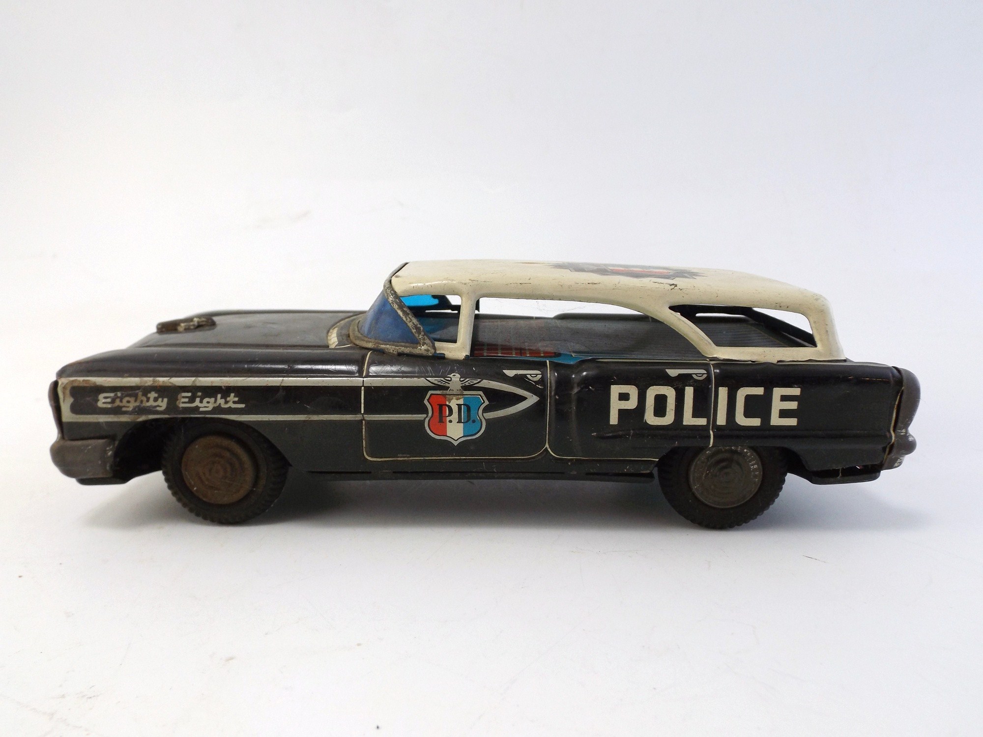 T.N.  Japanese Friction Toy Olds 88 Police Car