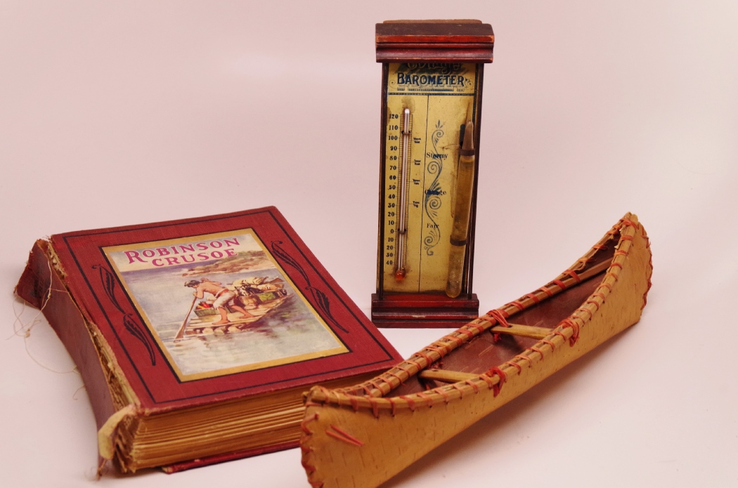 Robinson Crusoe with Vintage Model Canoe and Barometer