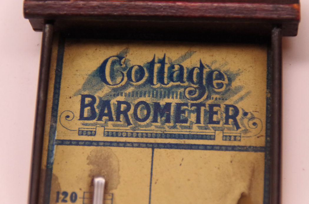 Robinson Crusoe with Vintage Model Canoe and Barometer