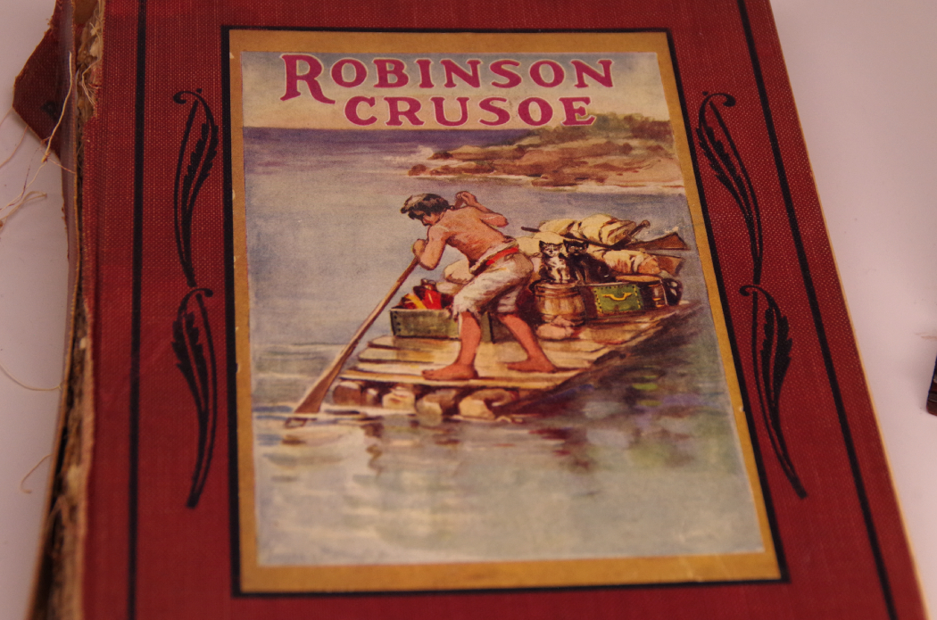 Robinson Crusoe with Vintage Model Canoe and Barometer