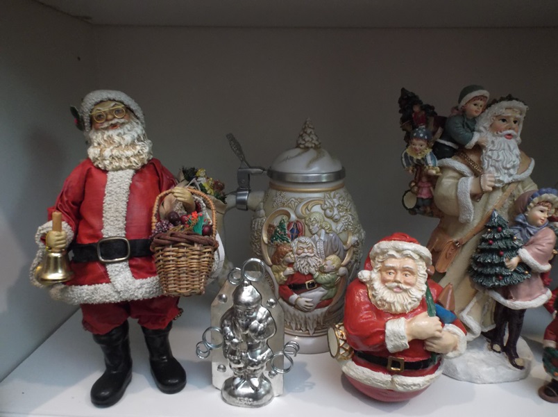 Assortment of Santa Claus Figurines and More