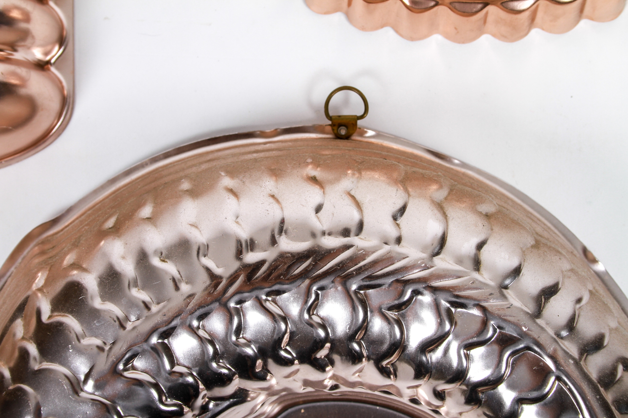 Four Mid-Century Copper Toned Aluminum Molds