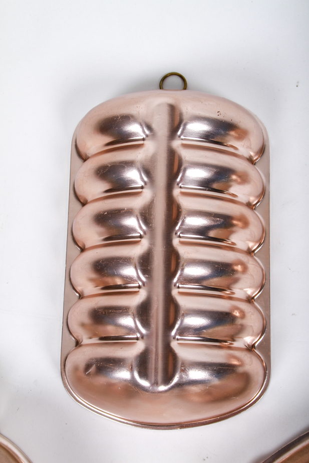 Four Mid-Century Copper Toned Aluminum Molds