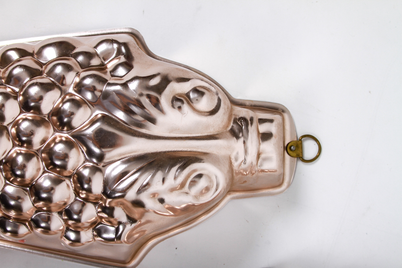 Four Mid-Century Copper Toned Aluminum Molds