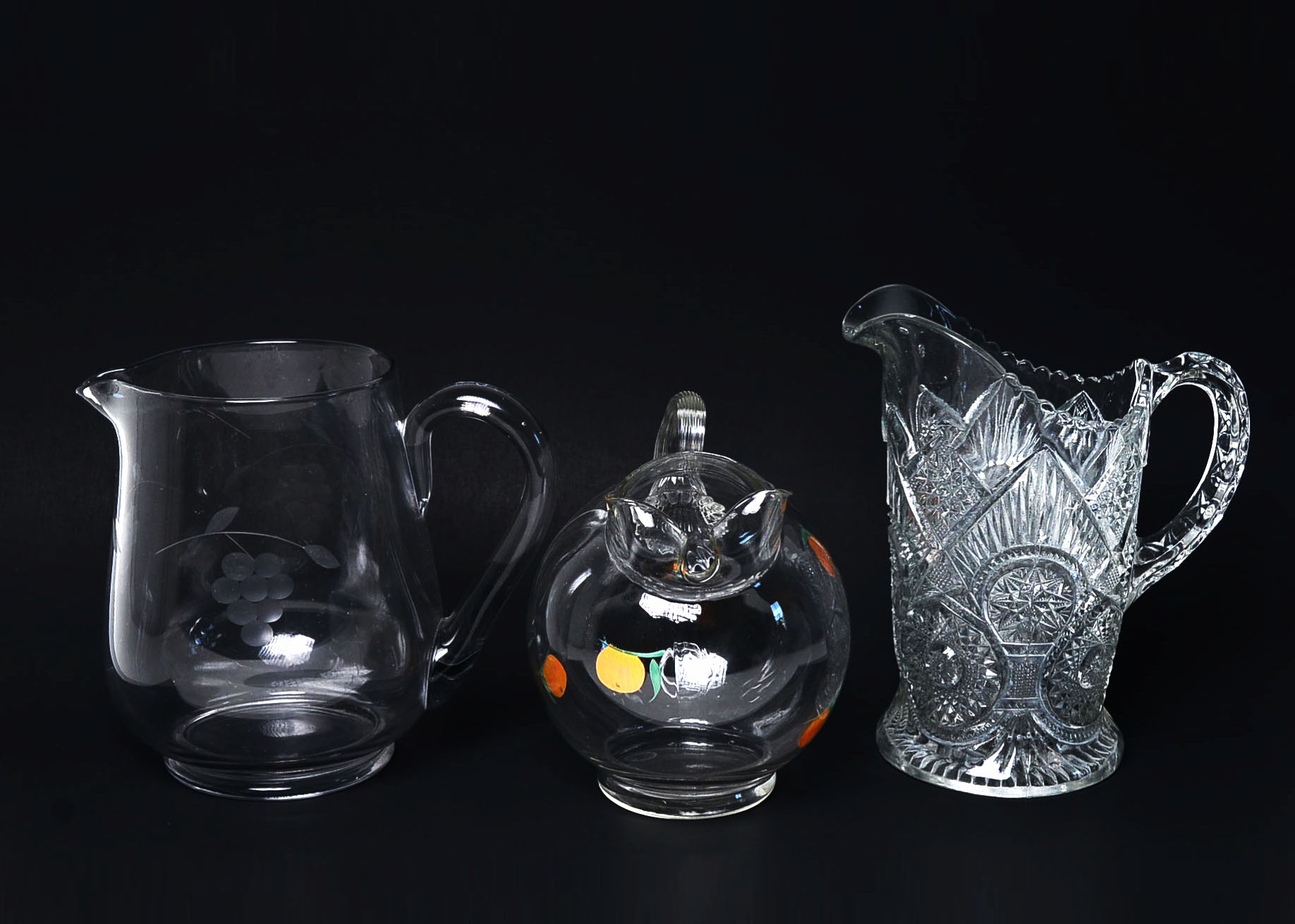 Three Vintage Glass Pitchers