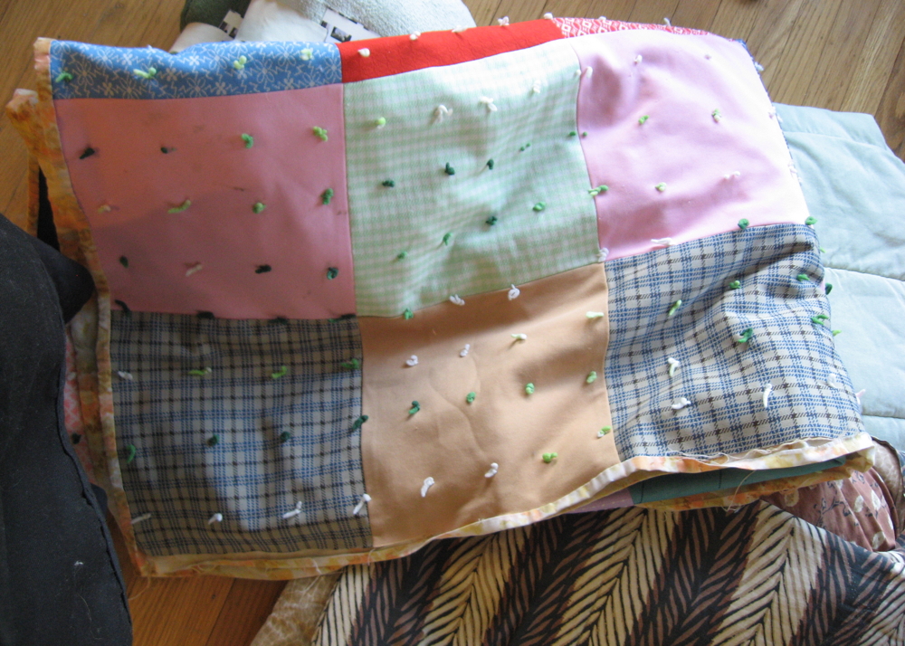 Collection of Multi-Colored Quilts and Blankets