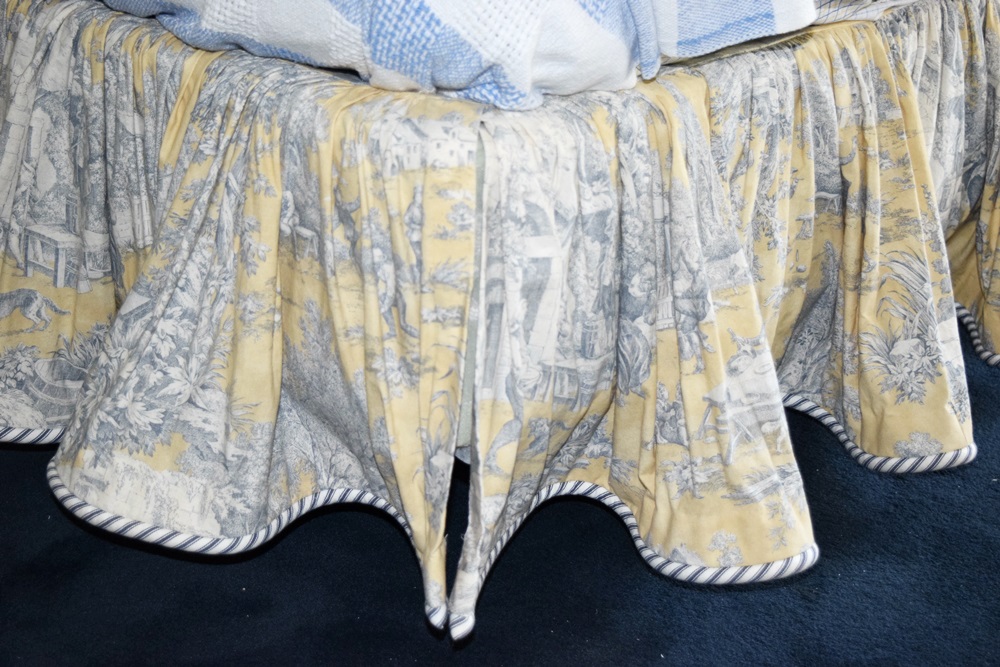 A King Size Bed with a Pretty Toile Upholstered Headboard