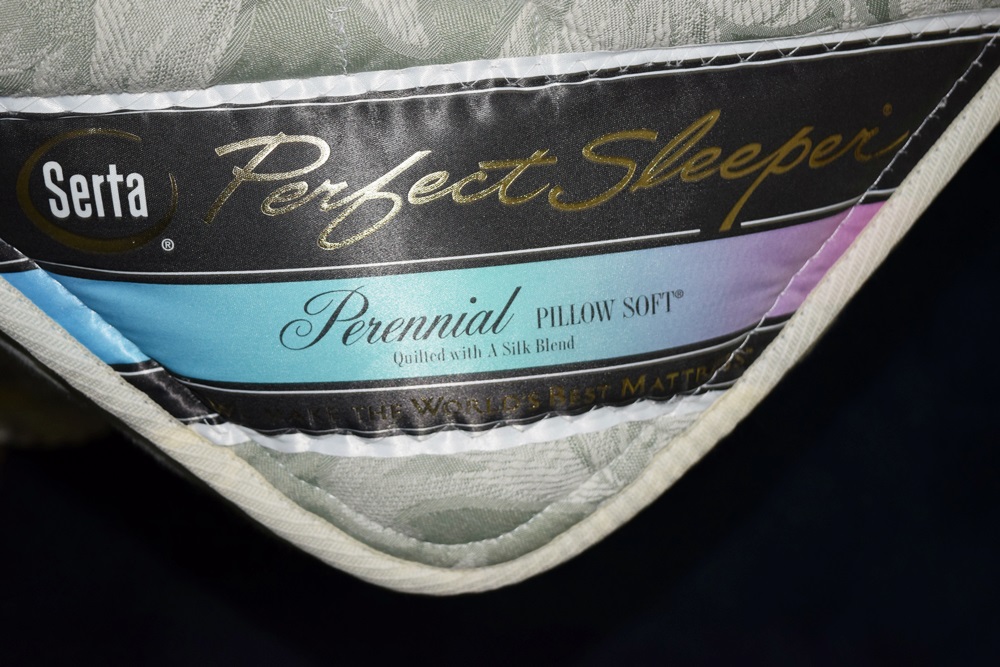 A King Size Bed with a Pretty Toile Upholstered Headboard