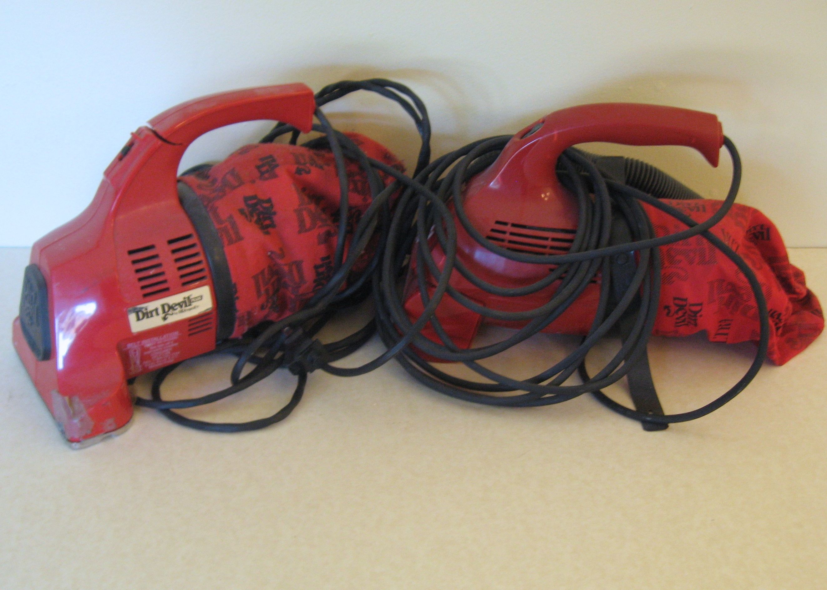 Two Dirt Devil Handheld Vacuums