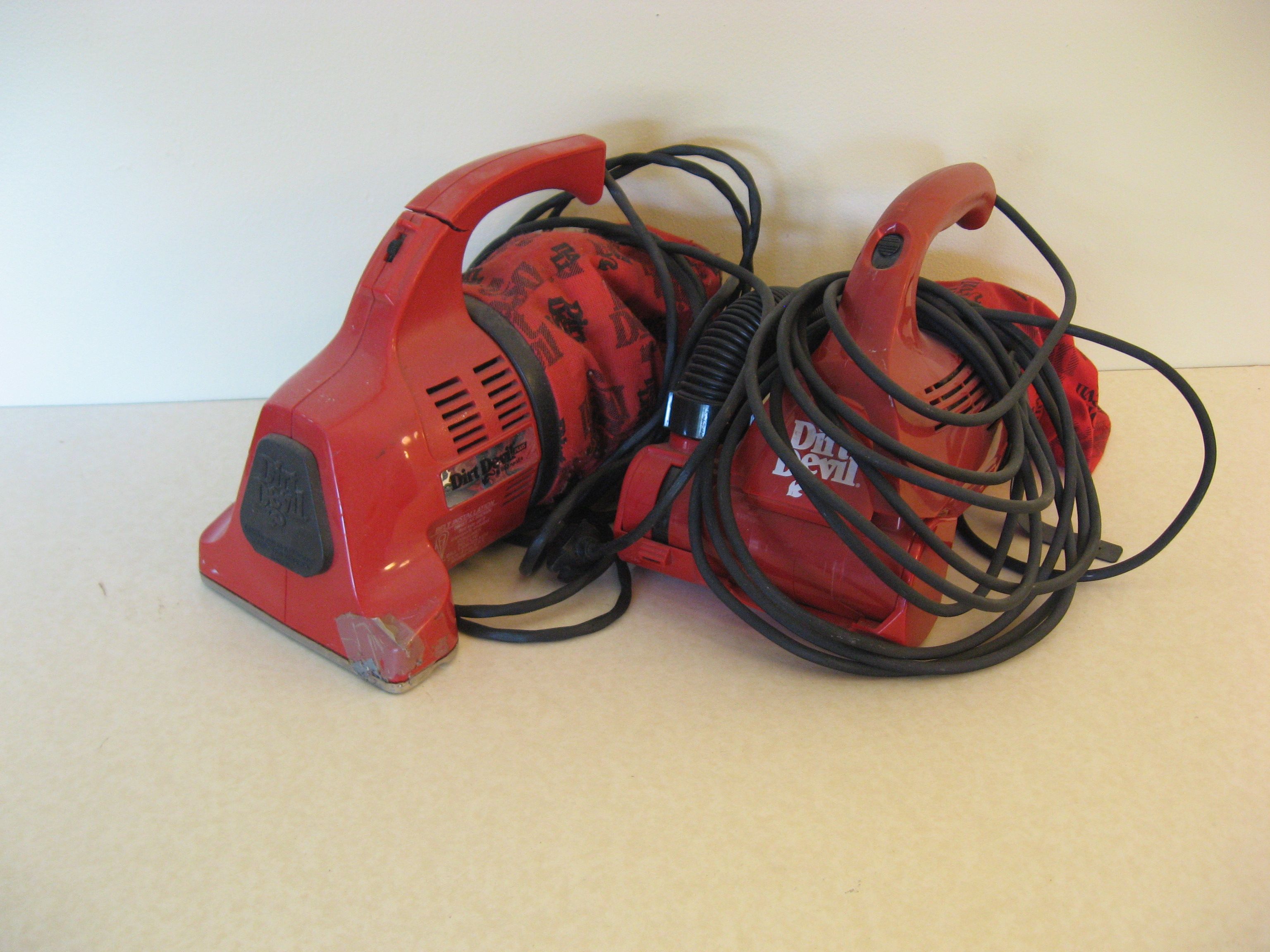 Two Dirt Devil Handheld Vacuums
