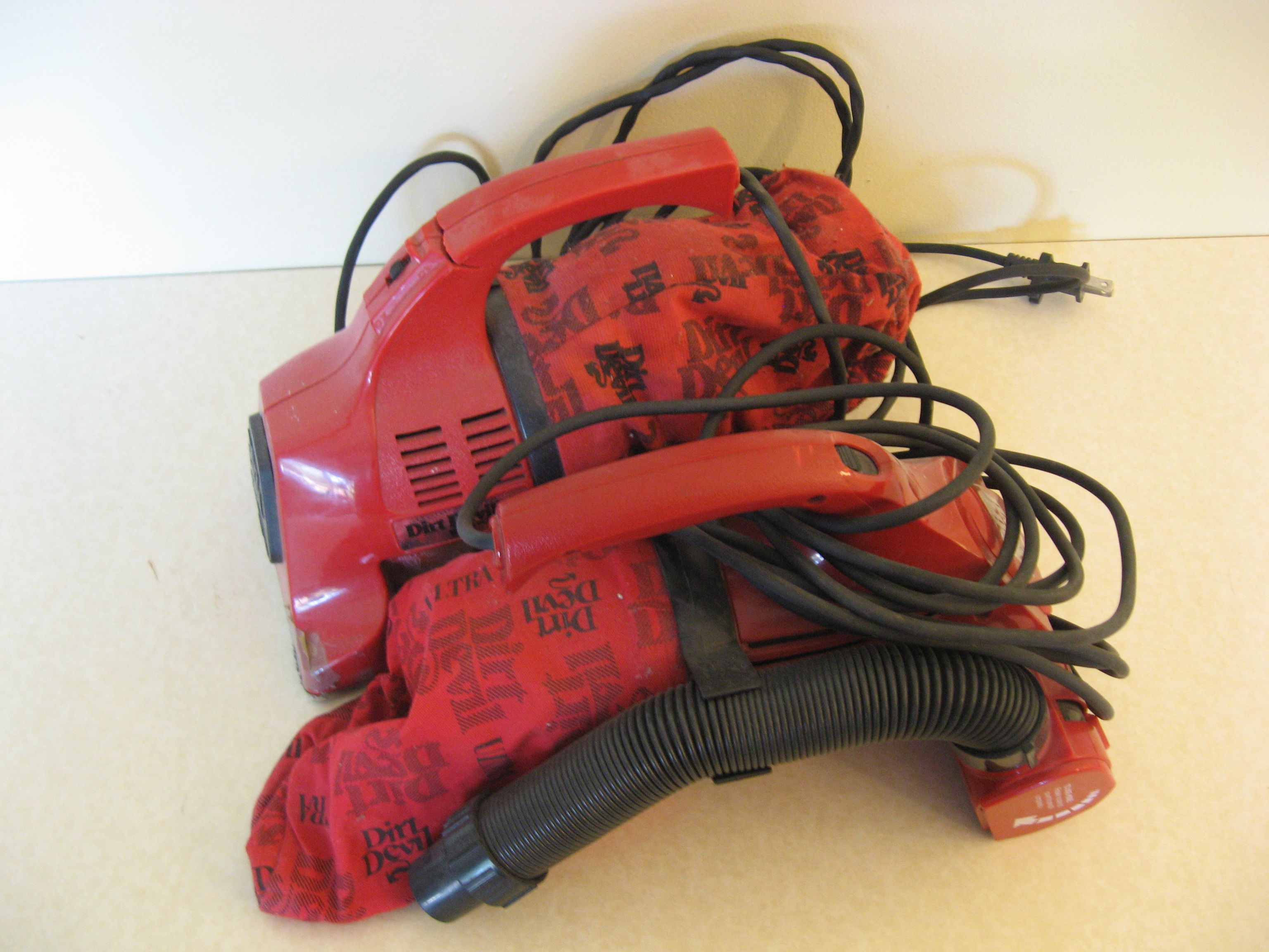 Two Dirt Devil Handheld Vacuums