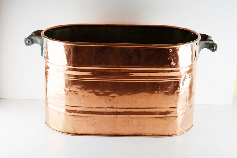 A Vintage Oval Copper Firewood Bucket with Wooden Handles