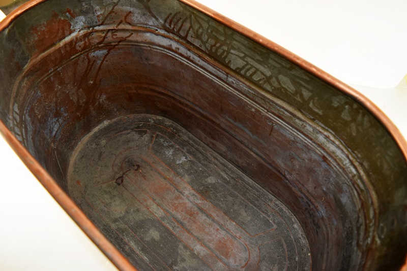 A Vintage Oval Copper Firewood Bucket with Wooden Handles