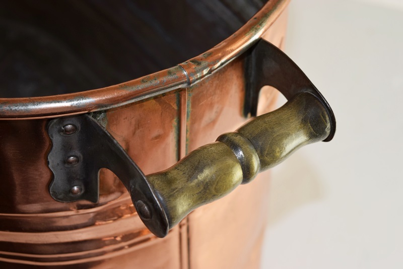 A Vintage Oval Copper Firewood Bucket with Wooden Handles