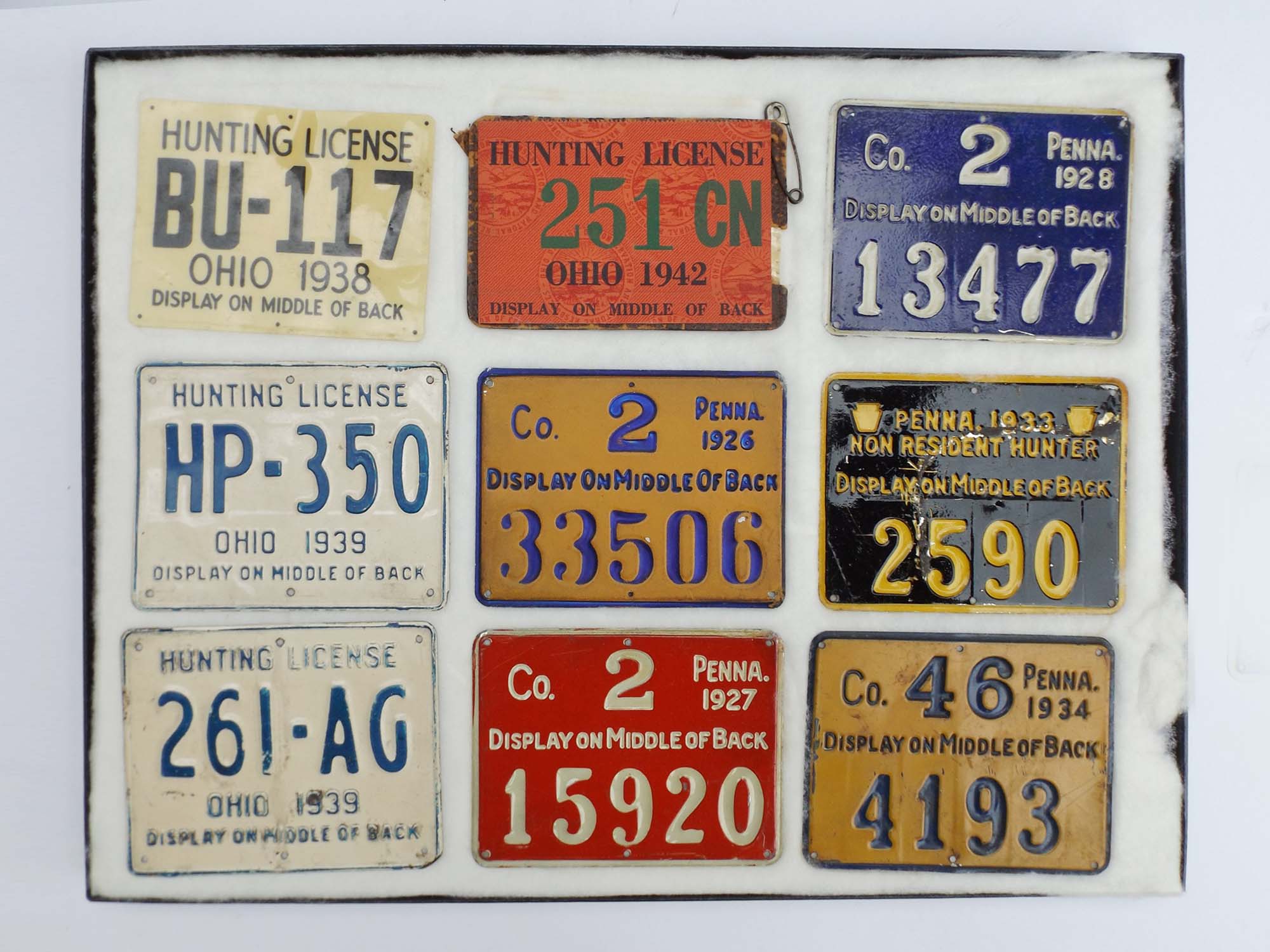 Group of Old Metal Hunting Licenses