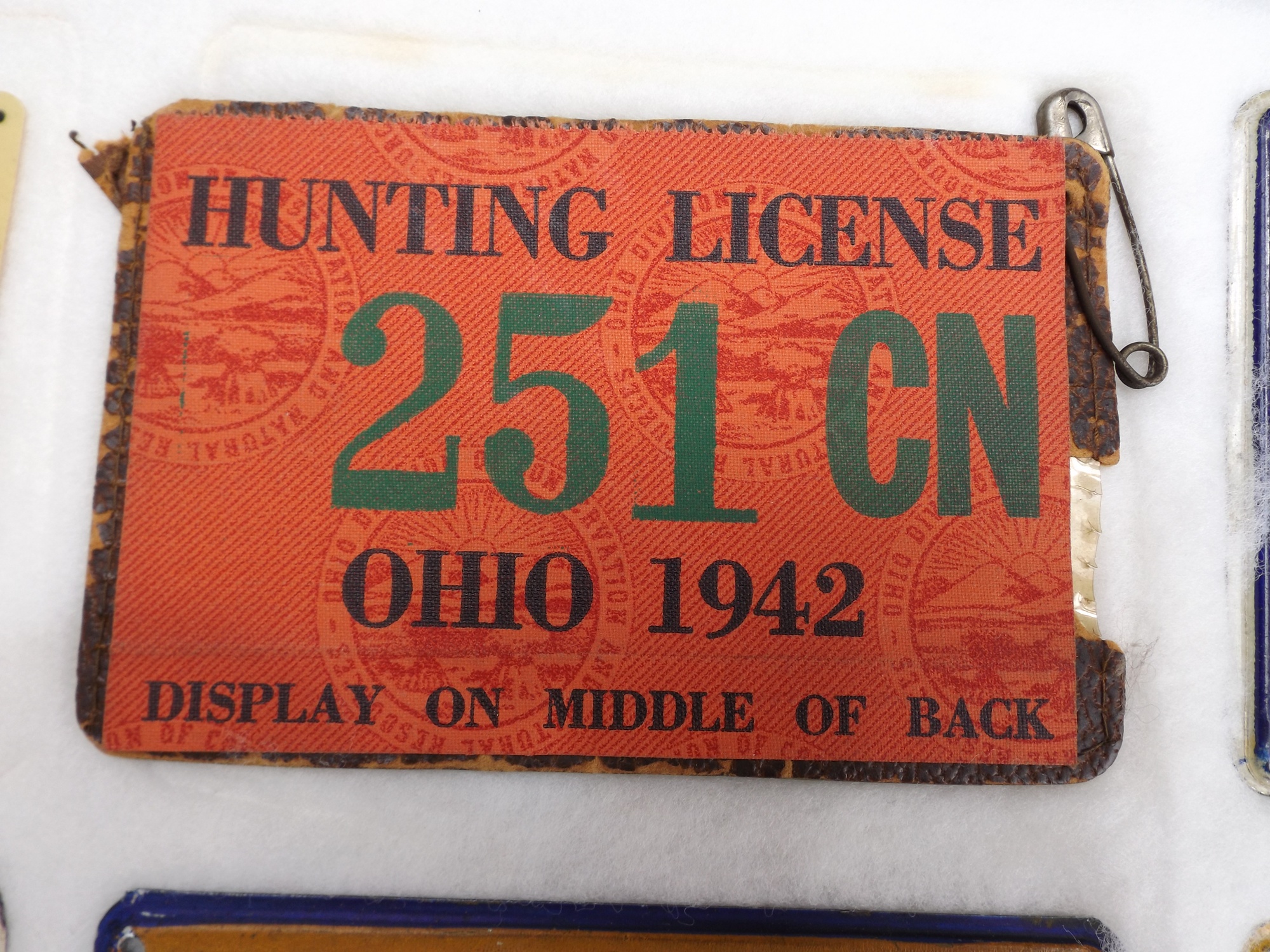 Group of Old Metal Hunting Licenses