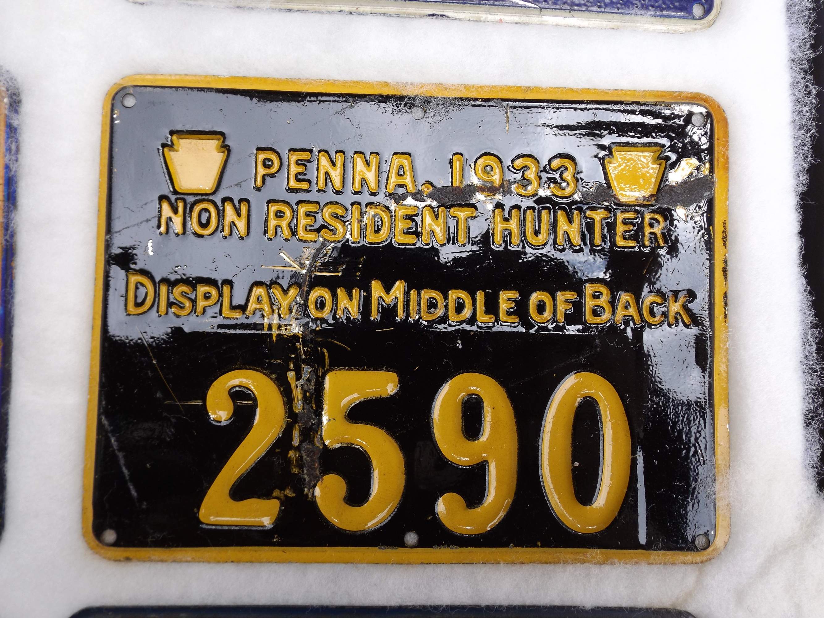 Group of Old Metal Hunting Licenses