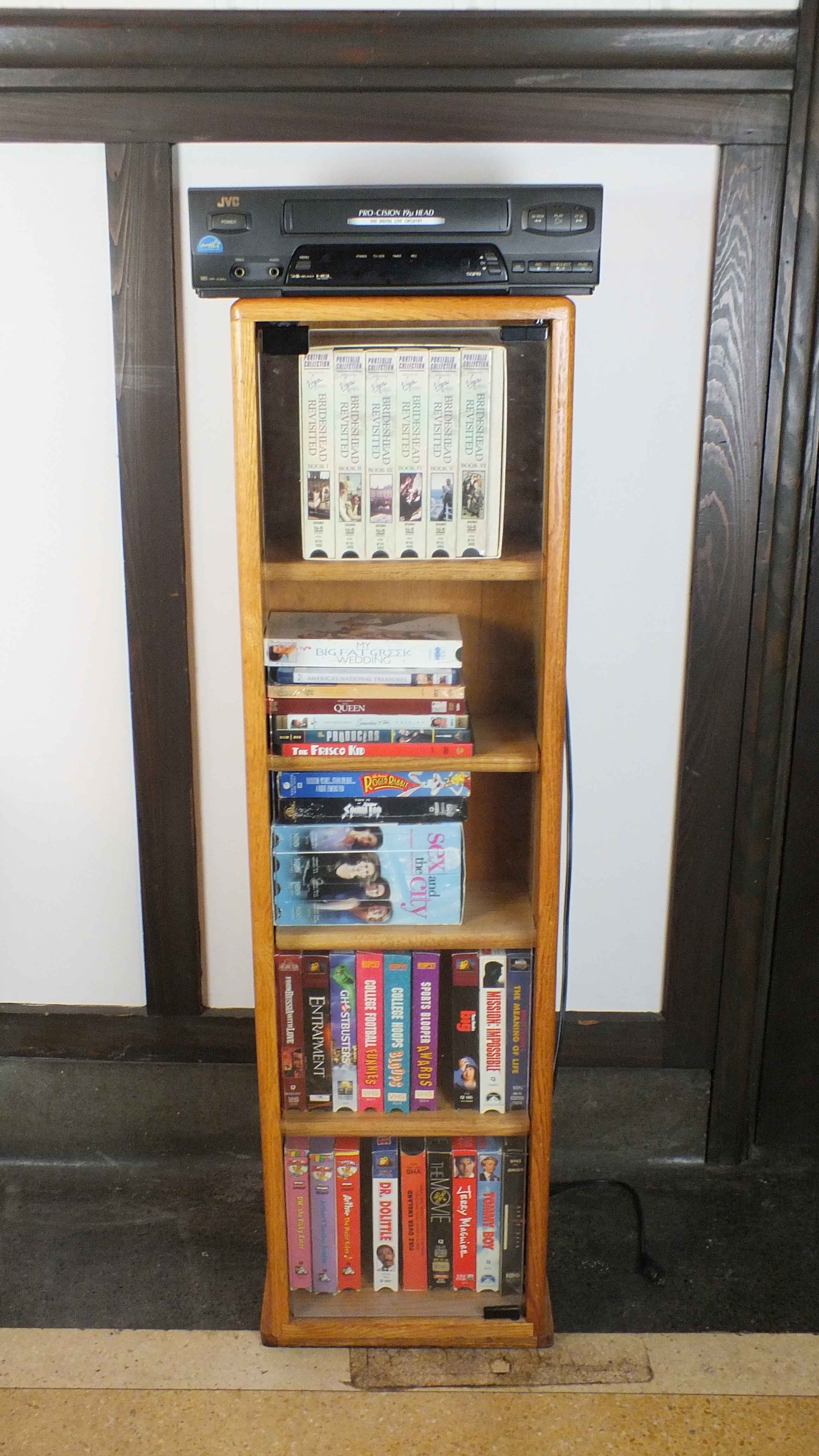 Popular Movie VHS Tapes,  VCR Player and Storage Cabinet