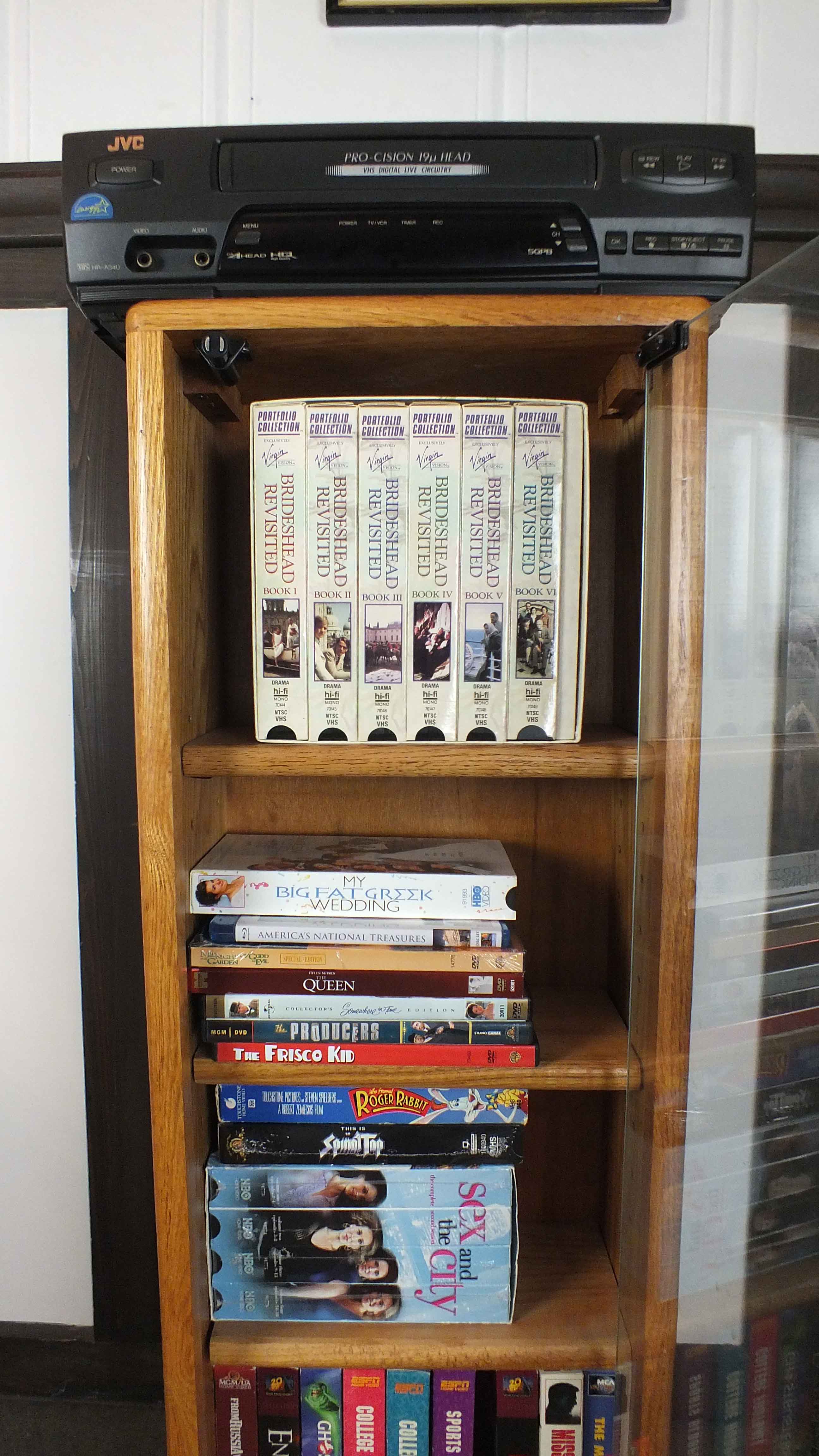 Popular Movie VHS Tapes,  VCR Player and Storage Cabinet