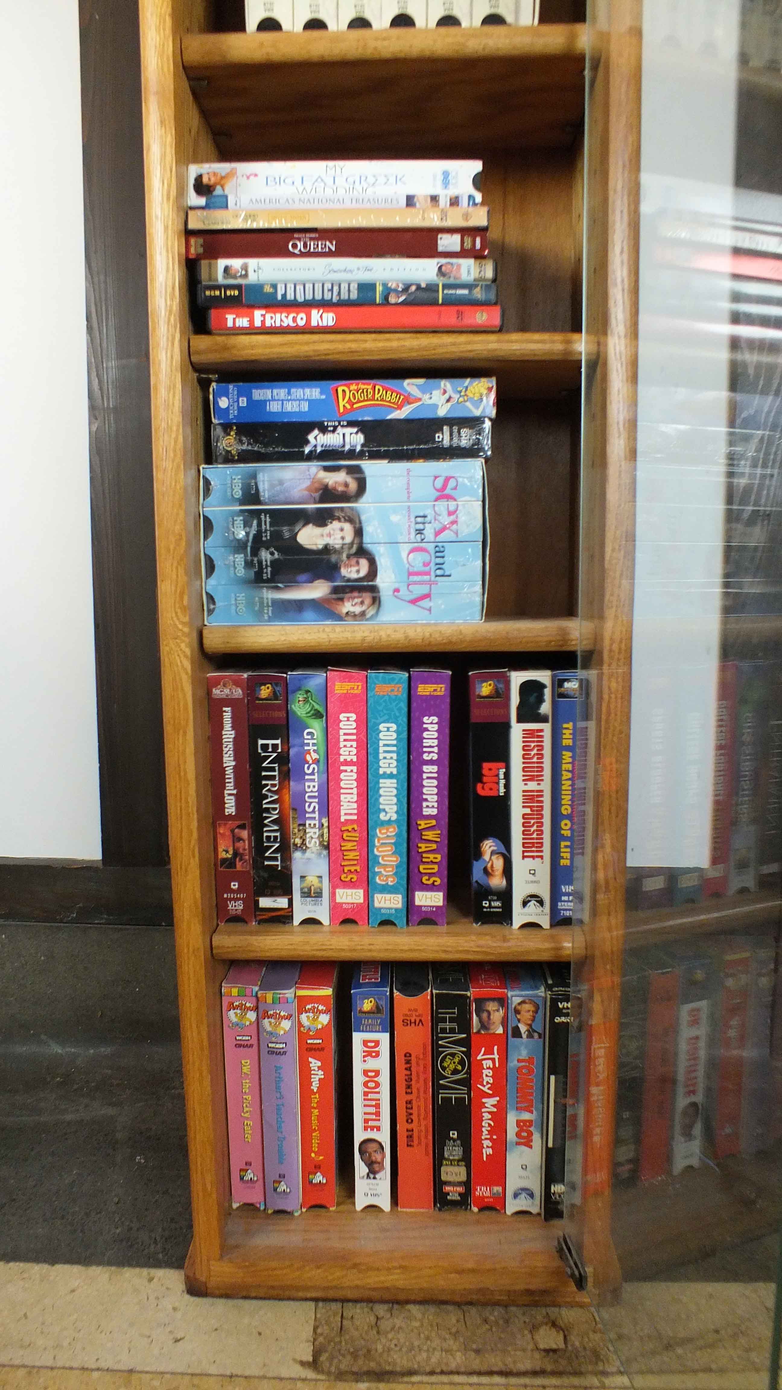 Popular Movie VHS Tapes,  VCR Player and Storage Cabinet