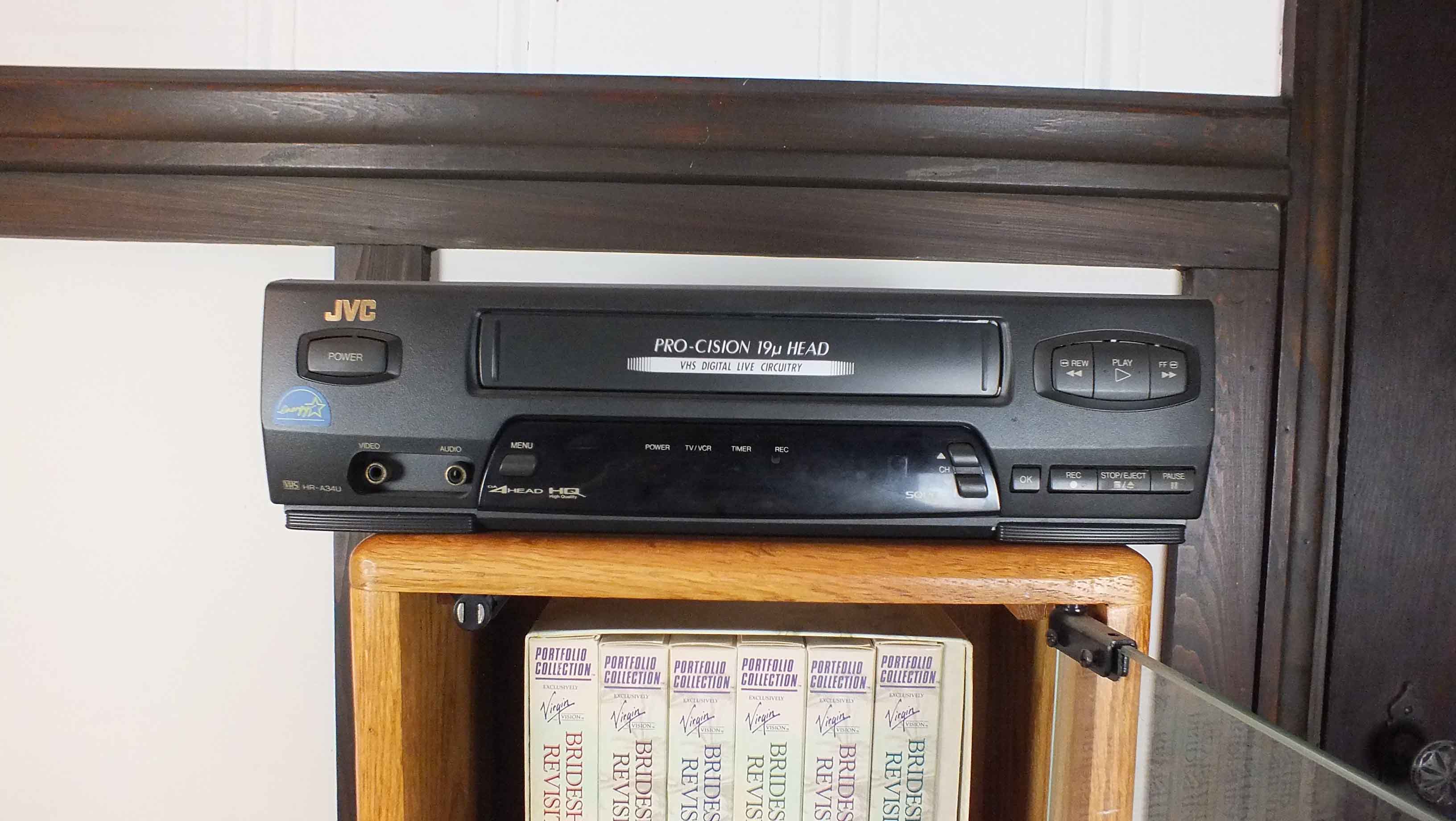 Popular Movie VHS Tapes,  VCR Player and Storage Cabinet