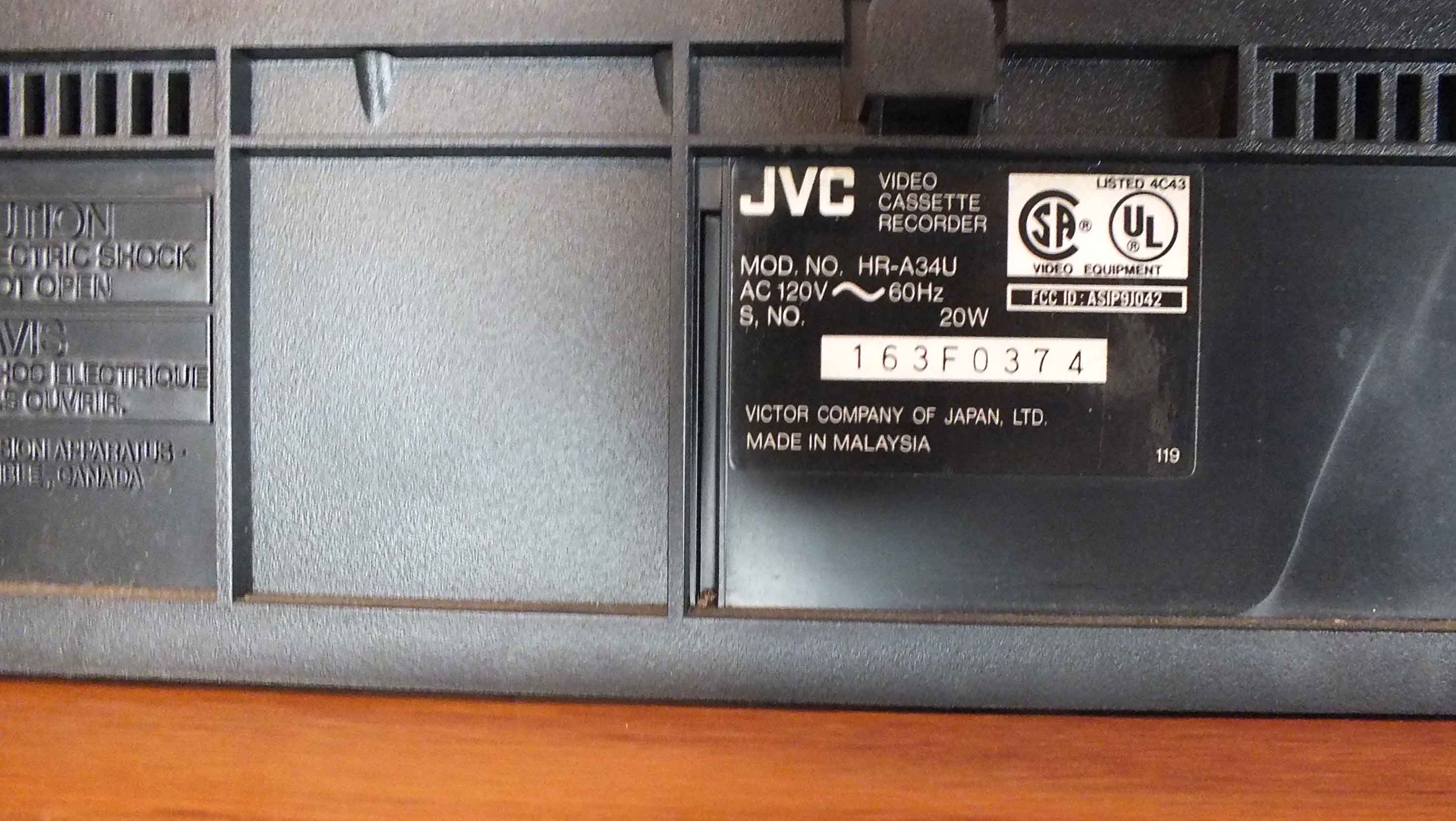 Popular Movie VHS Tapes,  VCR Player and Storage Cabinet