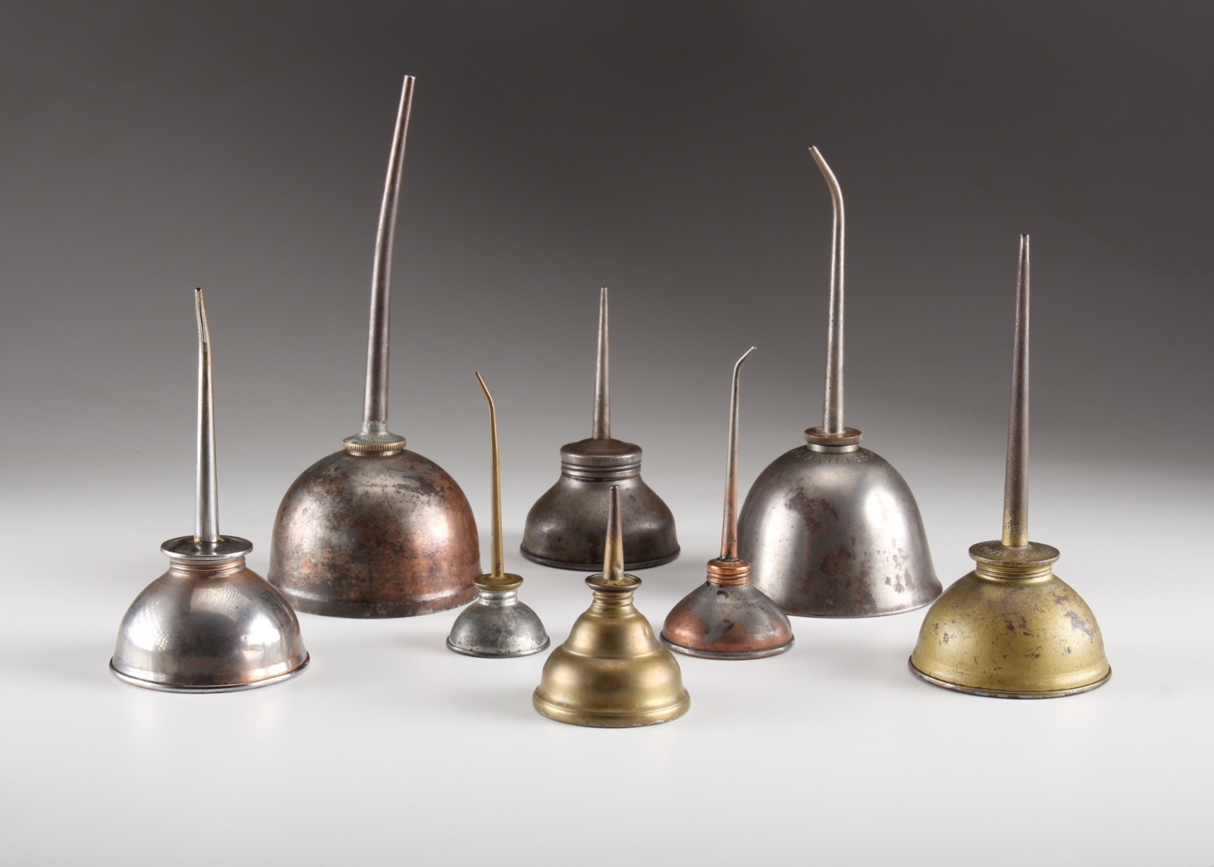 Eight Vintage Oil Cans