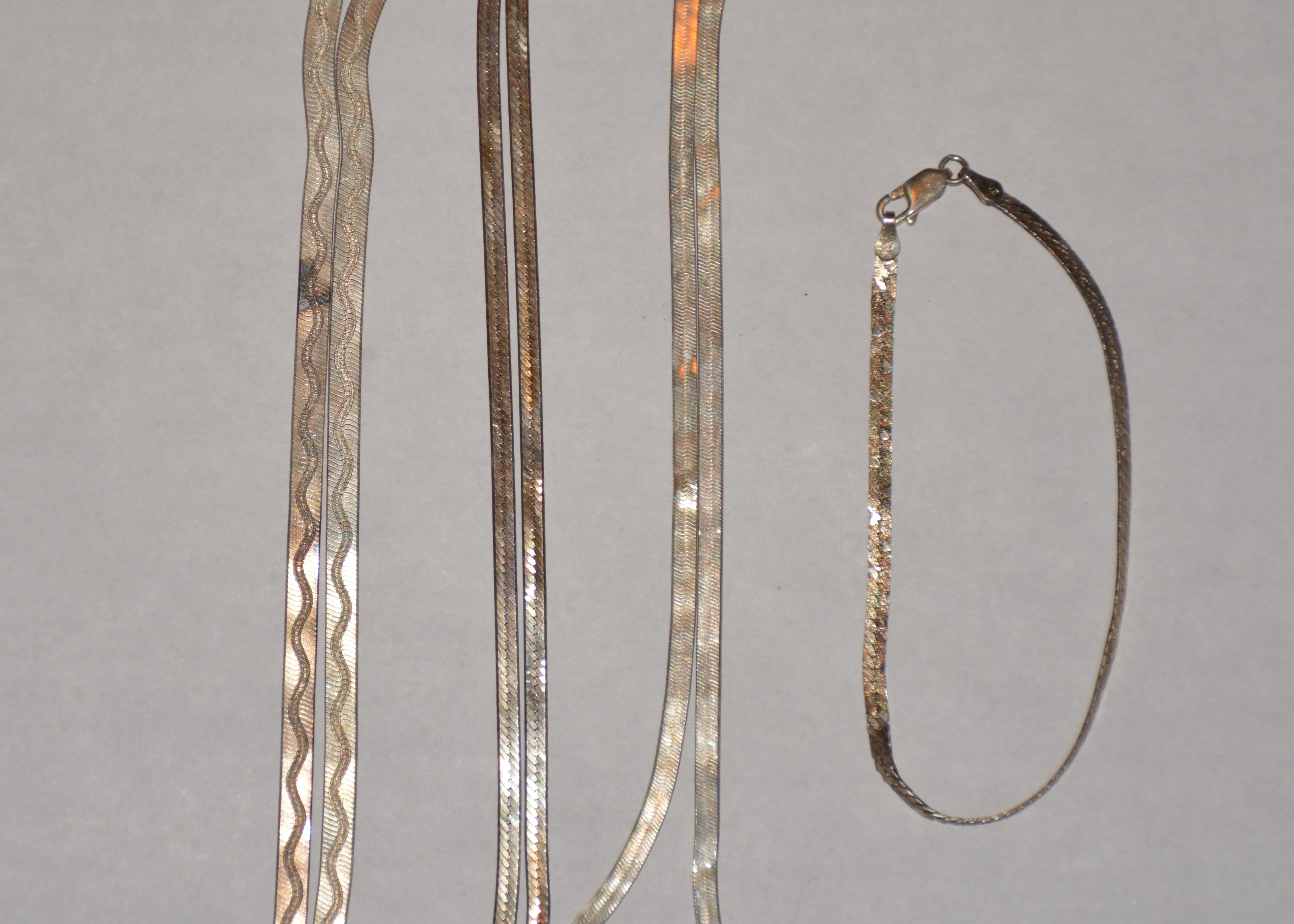 Three Sterling Silver Chains and One Bracelet