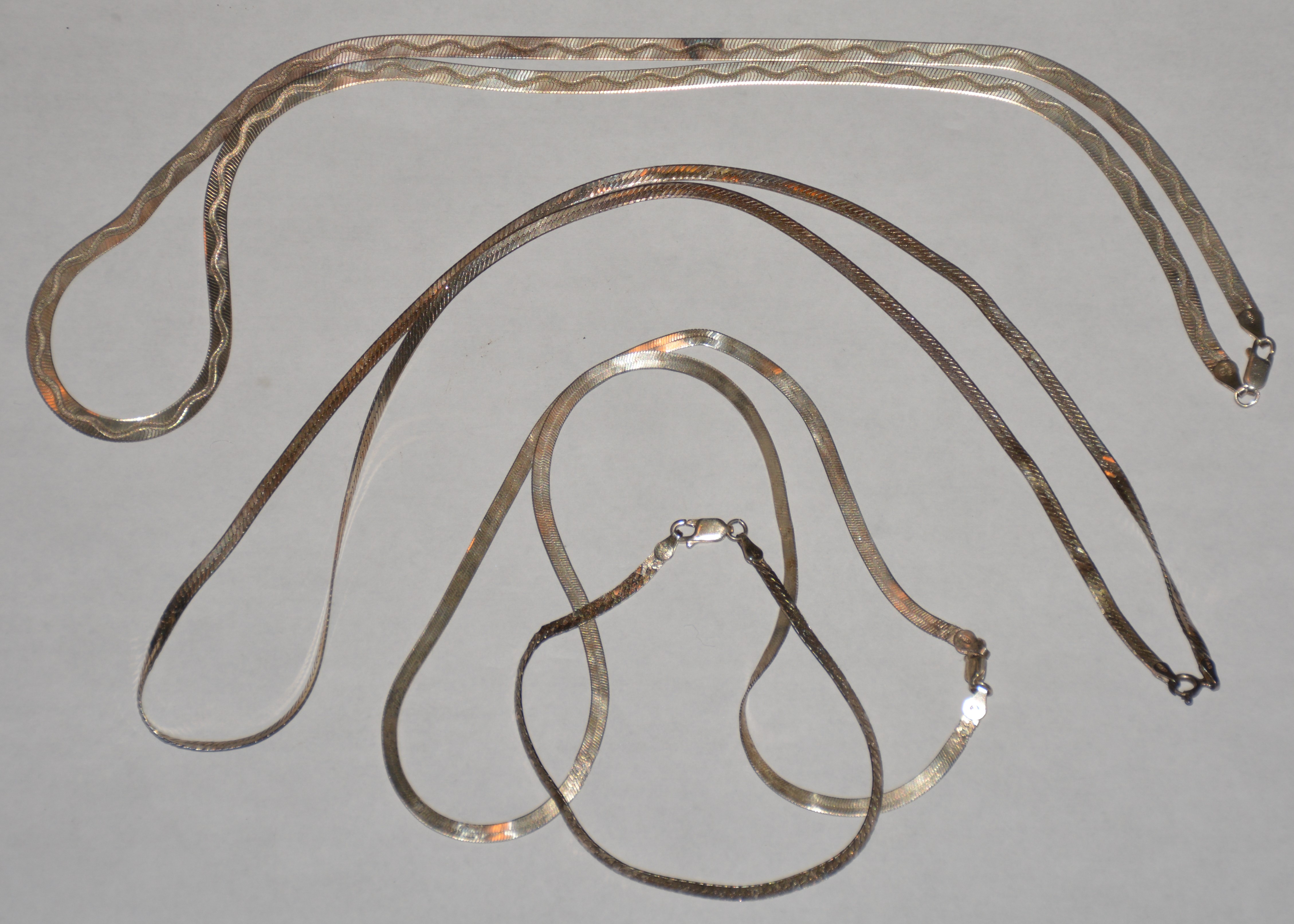Three Sterling Silver Chains and One Bracelet