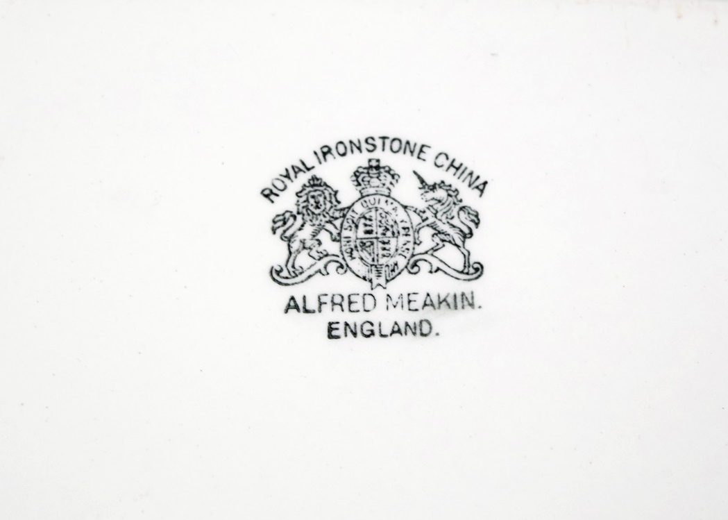 An Antique "Royal Ironstone China" Platter with Copper Lustre