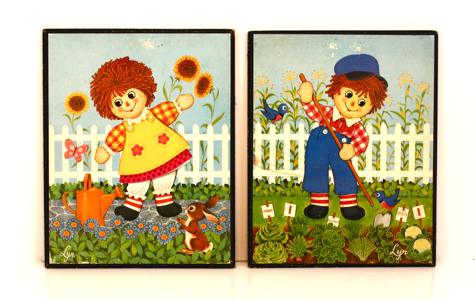 Vintage Collection of Raggedy Ann and Andy Dolls and Two Prints