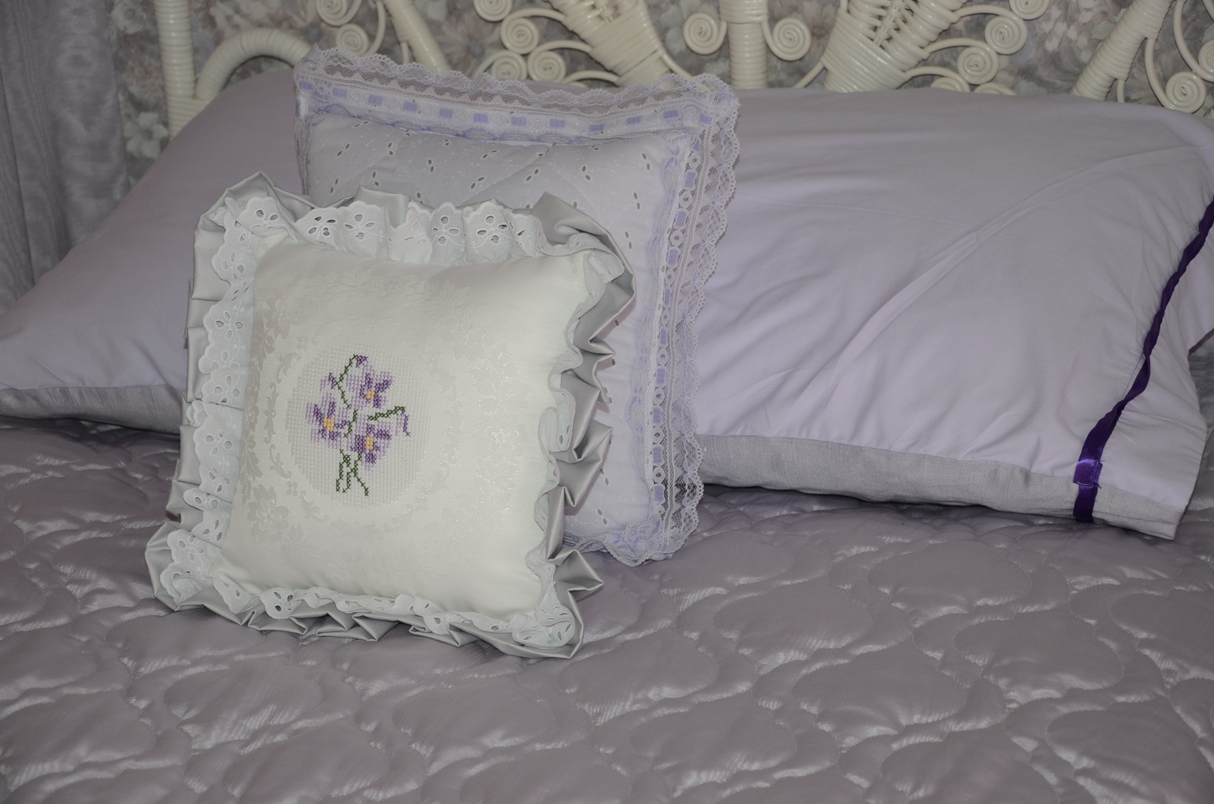 Pair of Twin White Wicker Beds with Violet Linens