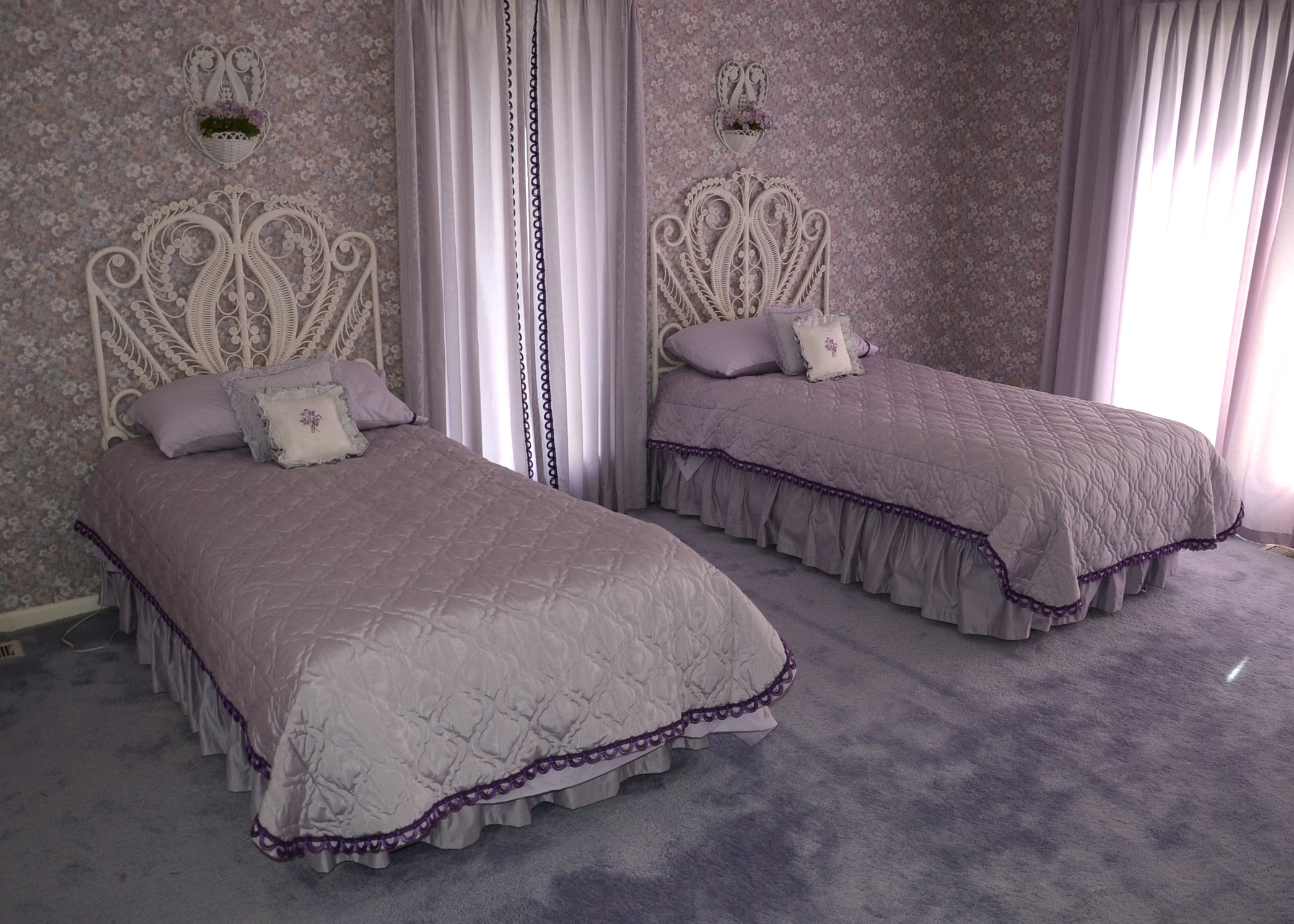 Pair of Twin White Wicker Beds with Violet Linens