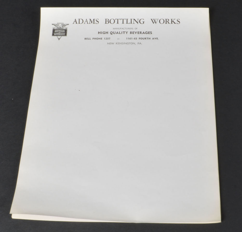 Collection of Vintage Soda Bottles and Ephemera