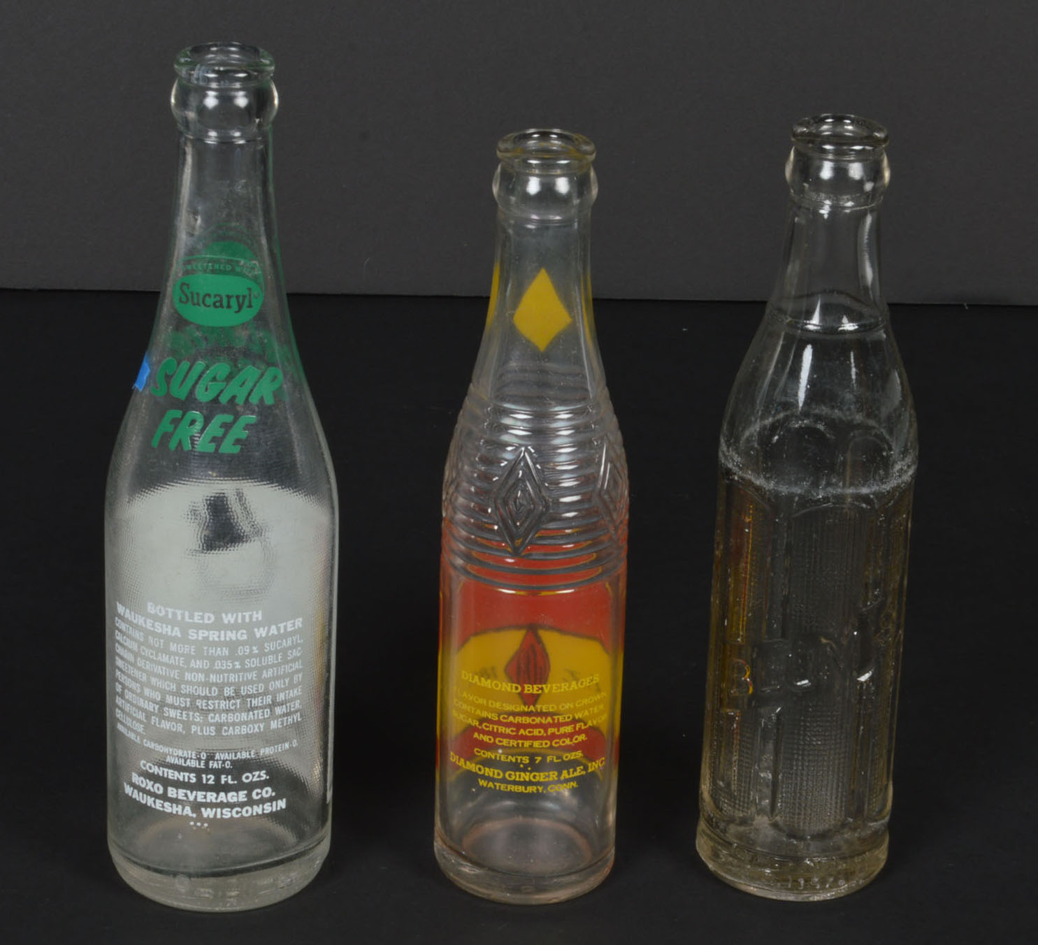 Collection of Vintage Soda Bottles and Ephemera
