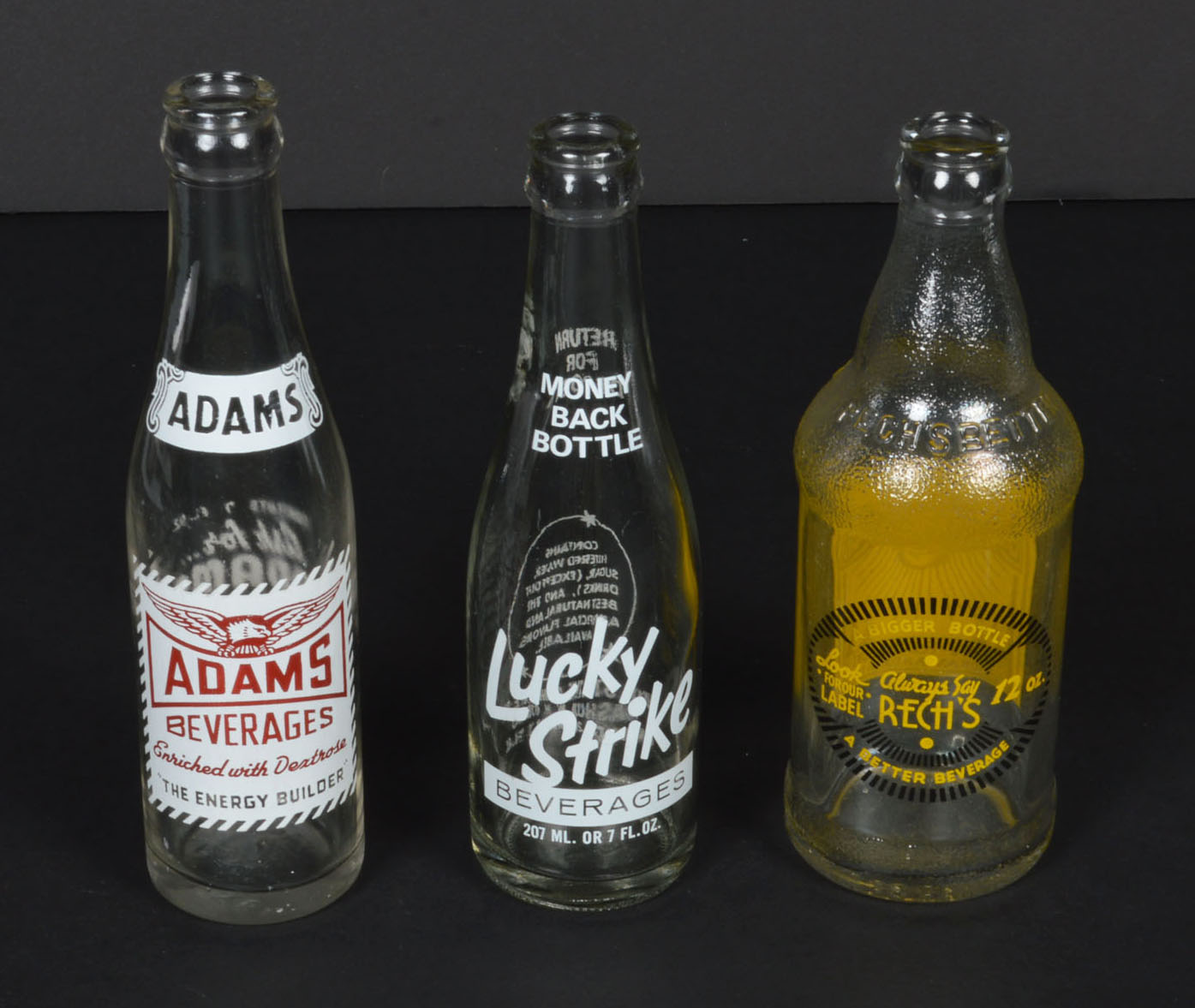 Collection of Vintage Soda Bottles and Ephemera