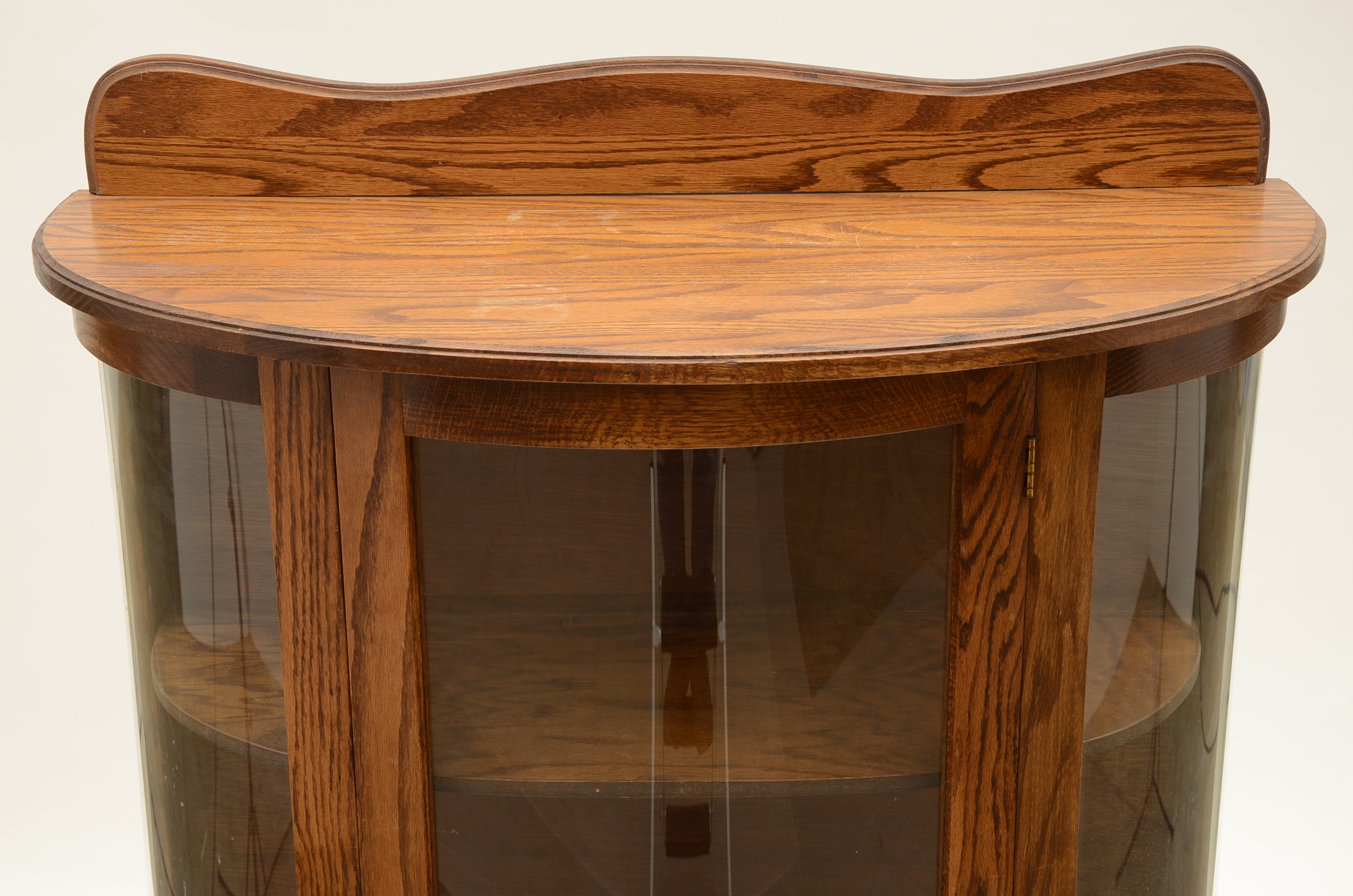 Round Front Oak Curio Cabinet