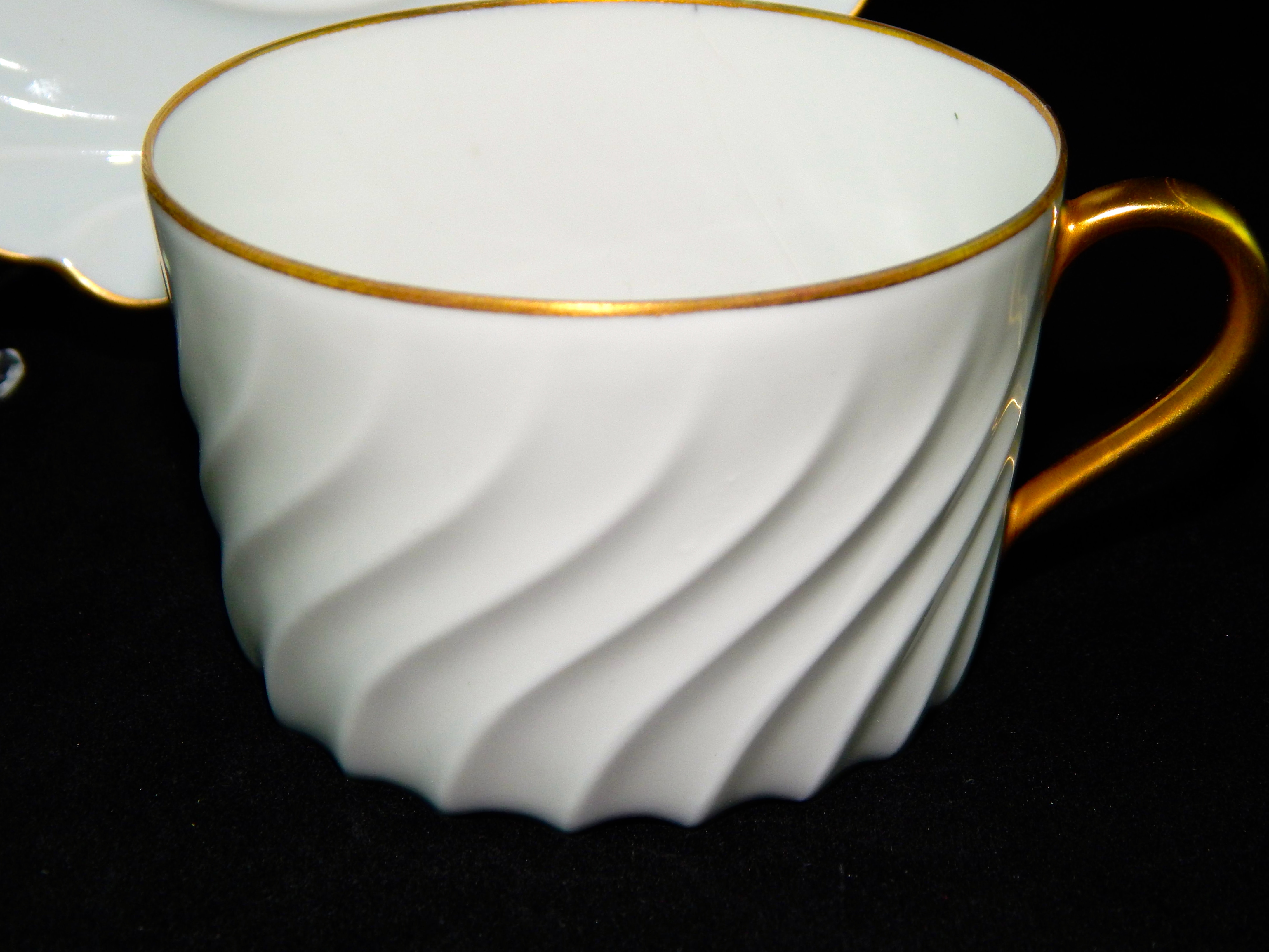 Three Limoges Cups and Saucers