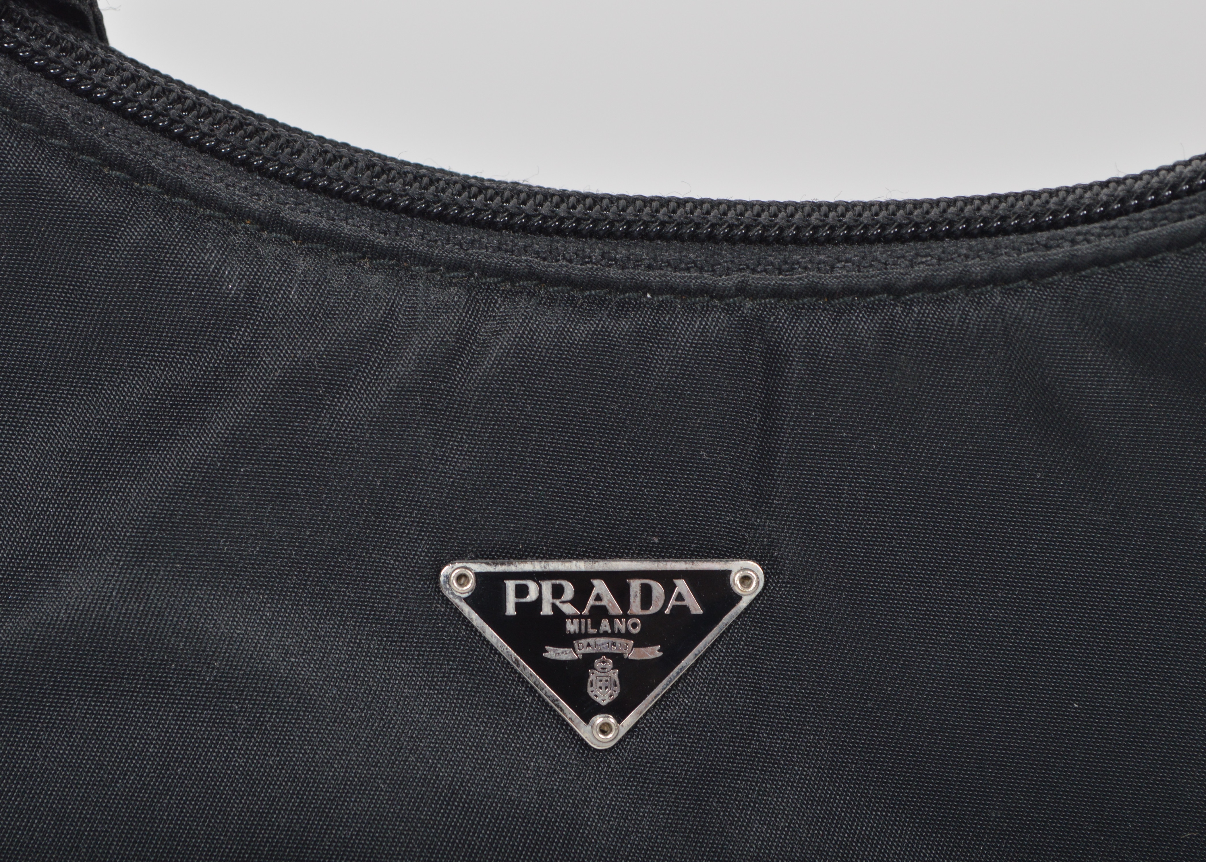 A Set of Two Black Designer Handbags