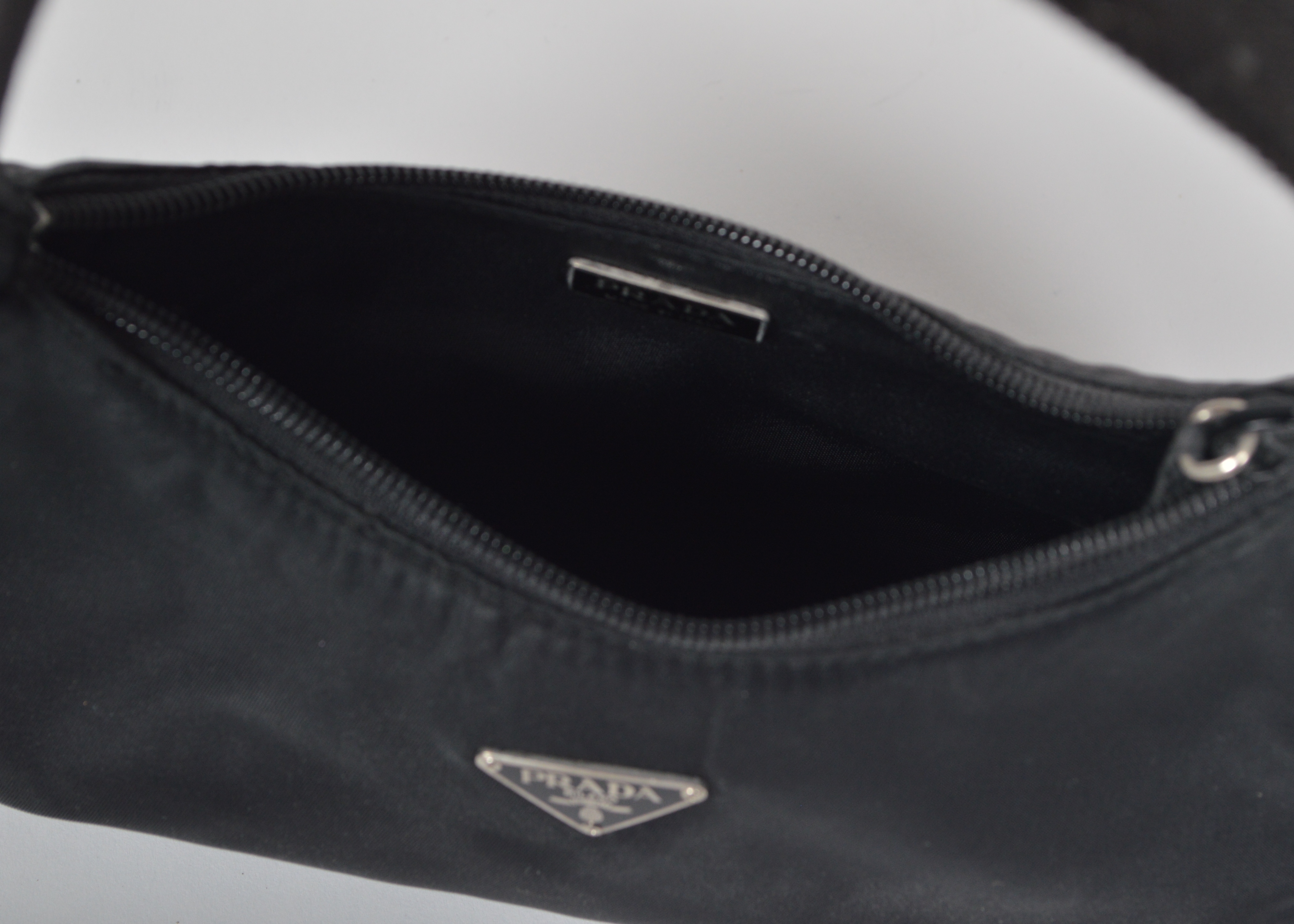 A Set of Two Black Designer Handbags