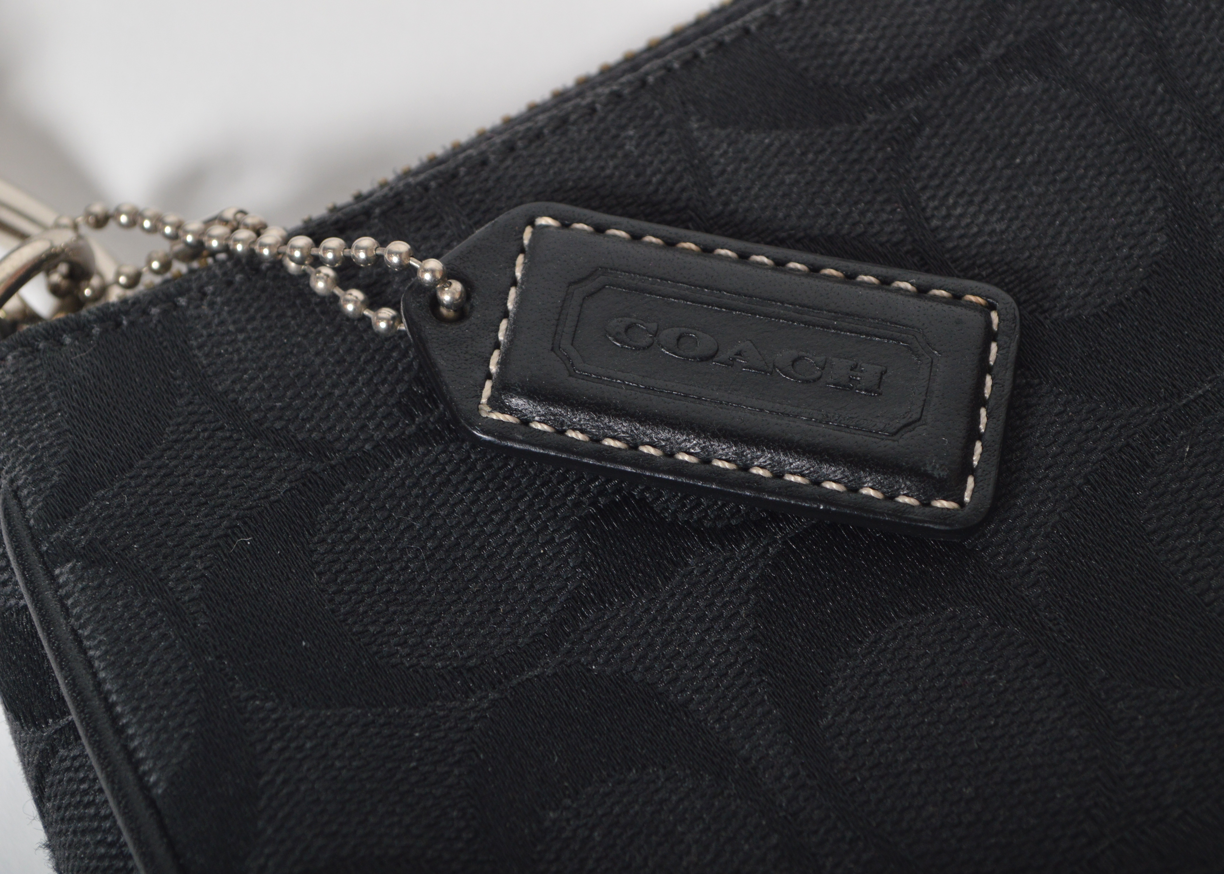 A Set of Two Black Designer Handbags