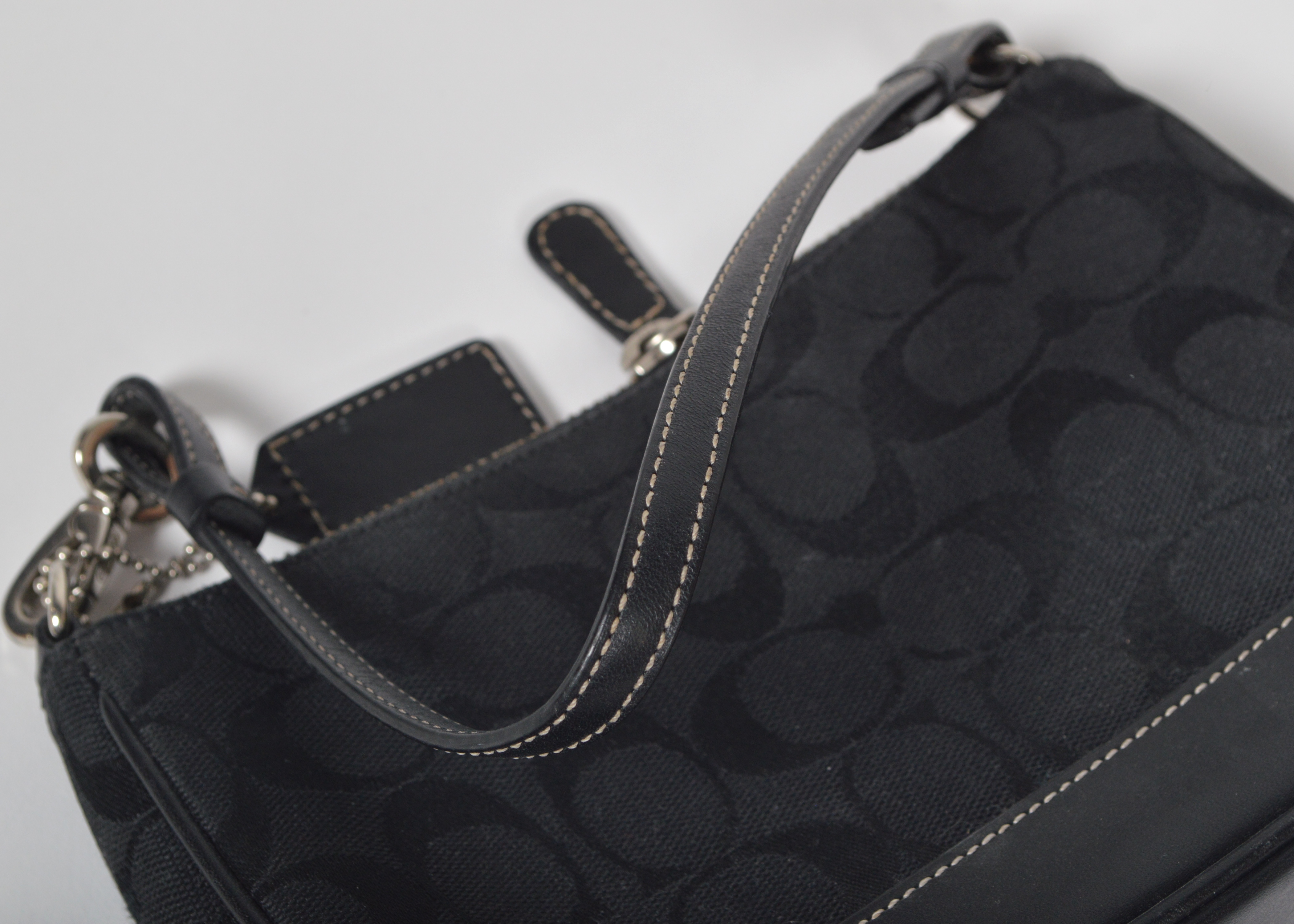 A Set of Two Black Designer Handbags