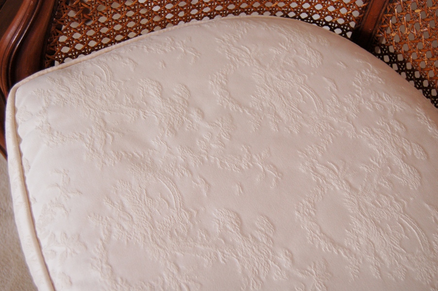 Pair of Caned Armchairs with Creme Cushion