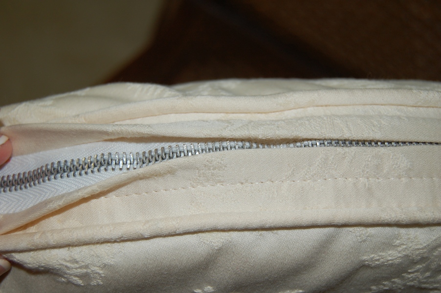 Pair of Caned Armchairs with Creme Cushion