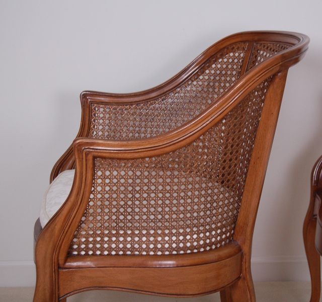 Pair of Caned Armchairs with Creme Cushion