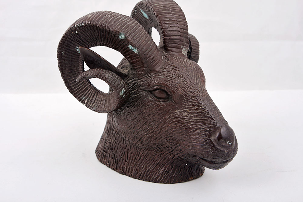 Pair of Ram Head Figurines