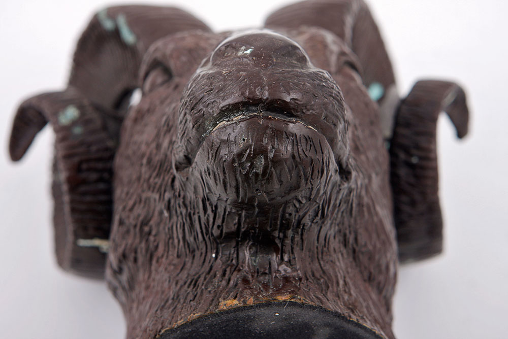 Pair of Ram Head Figurines