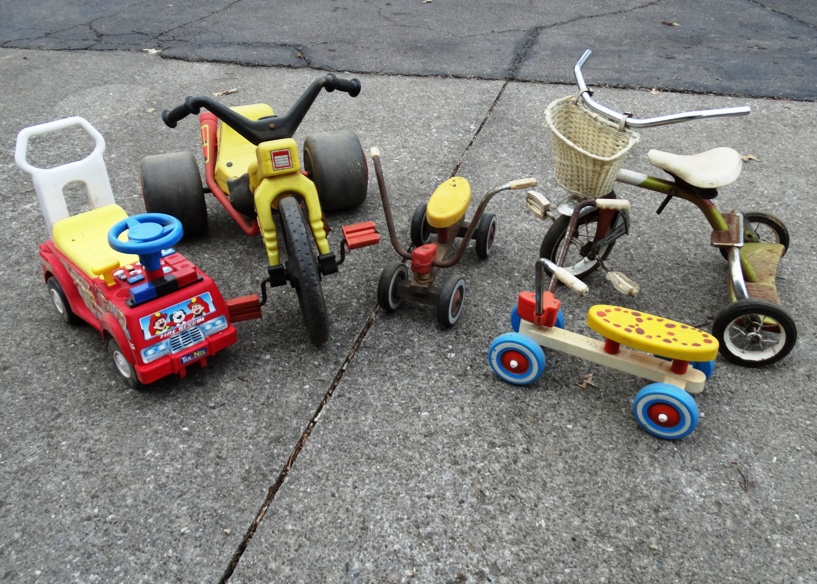 Group of Vintage Scooters and Other Wheeled Toys